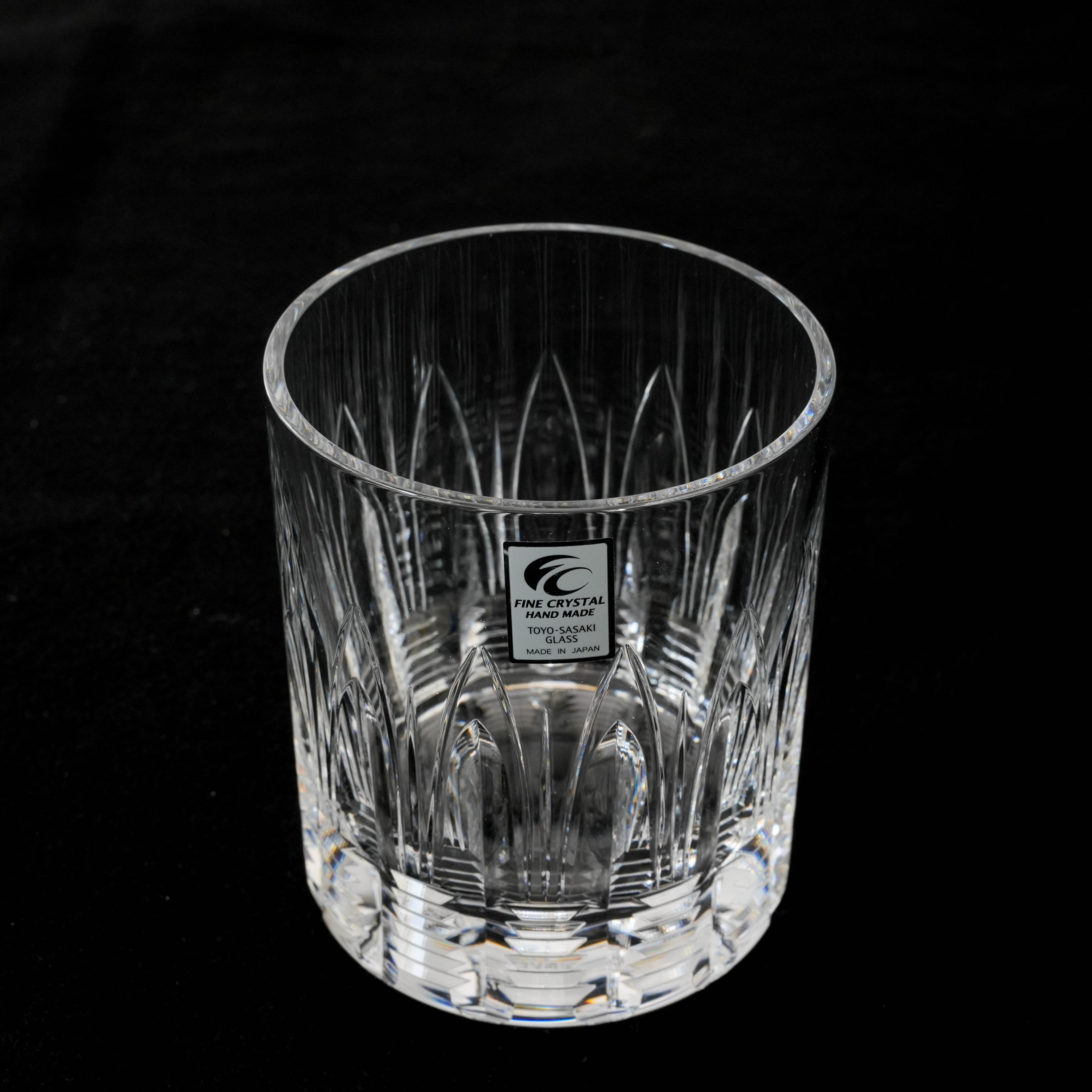 Toyo-Sasaki Fine Crystal Whiskey Glass - Rising Light shown on black background, featuring intricate cut patterns and eco-friendly lead-free crystal.