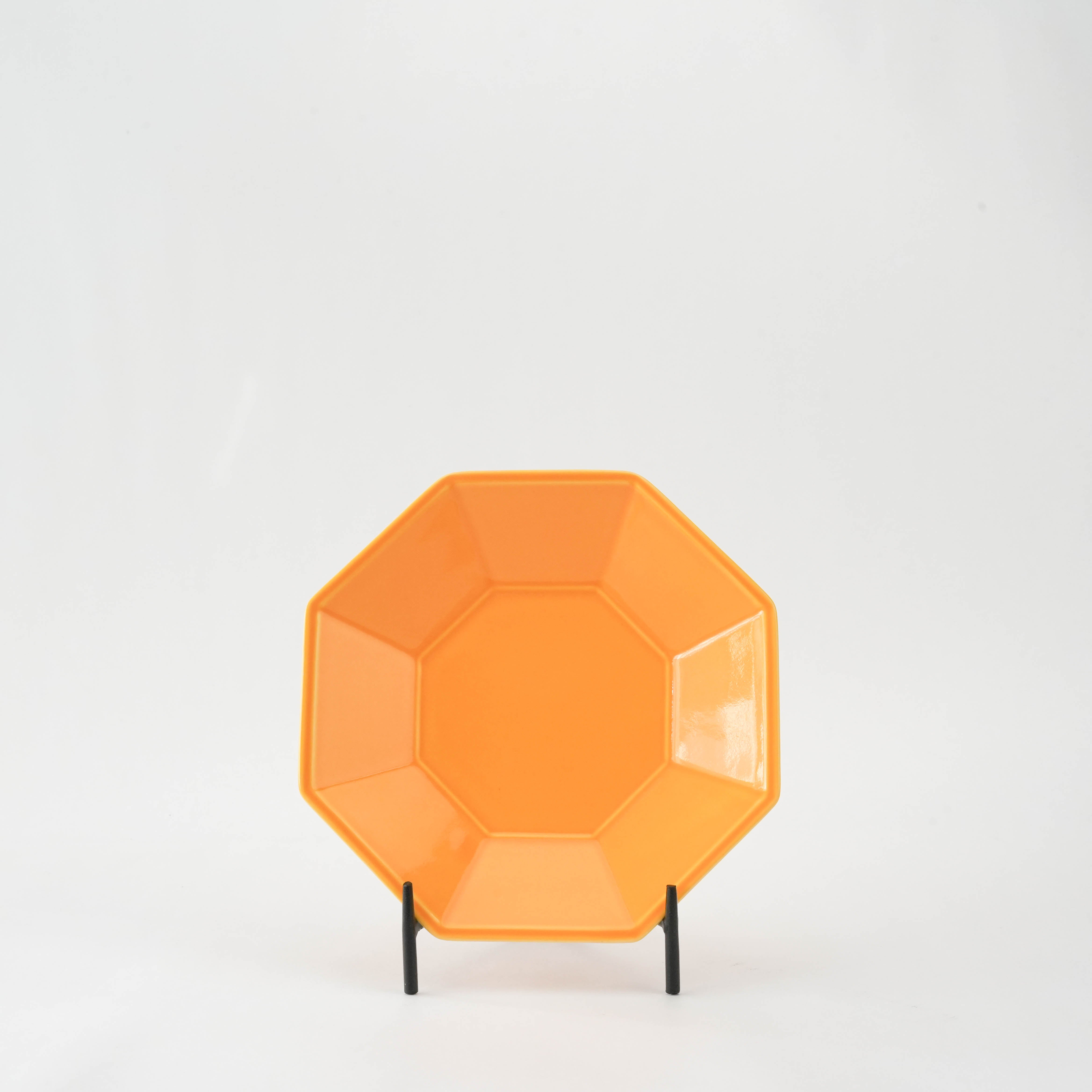 Yellow Glaze Octagonal Plate - Mino Ware displayed upright on stand, showcasing its vibrant modern Japanese design and glossy finish.