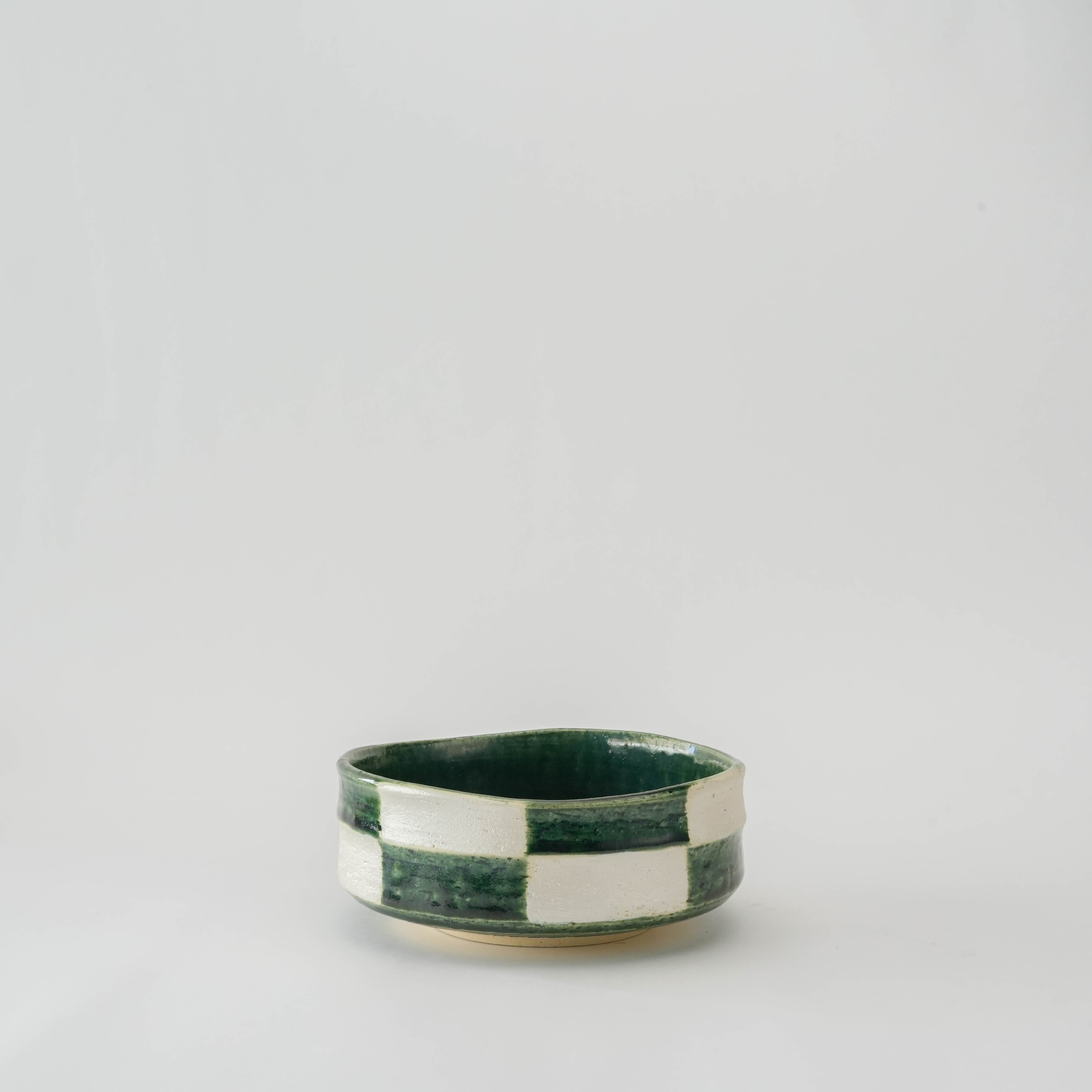 Mino Ware Kiritsuke Bowl in deep Oribe green with Ichimatsu checkered pattern, ideal for serving side dishes in Japanese-style table settings.