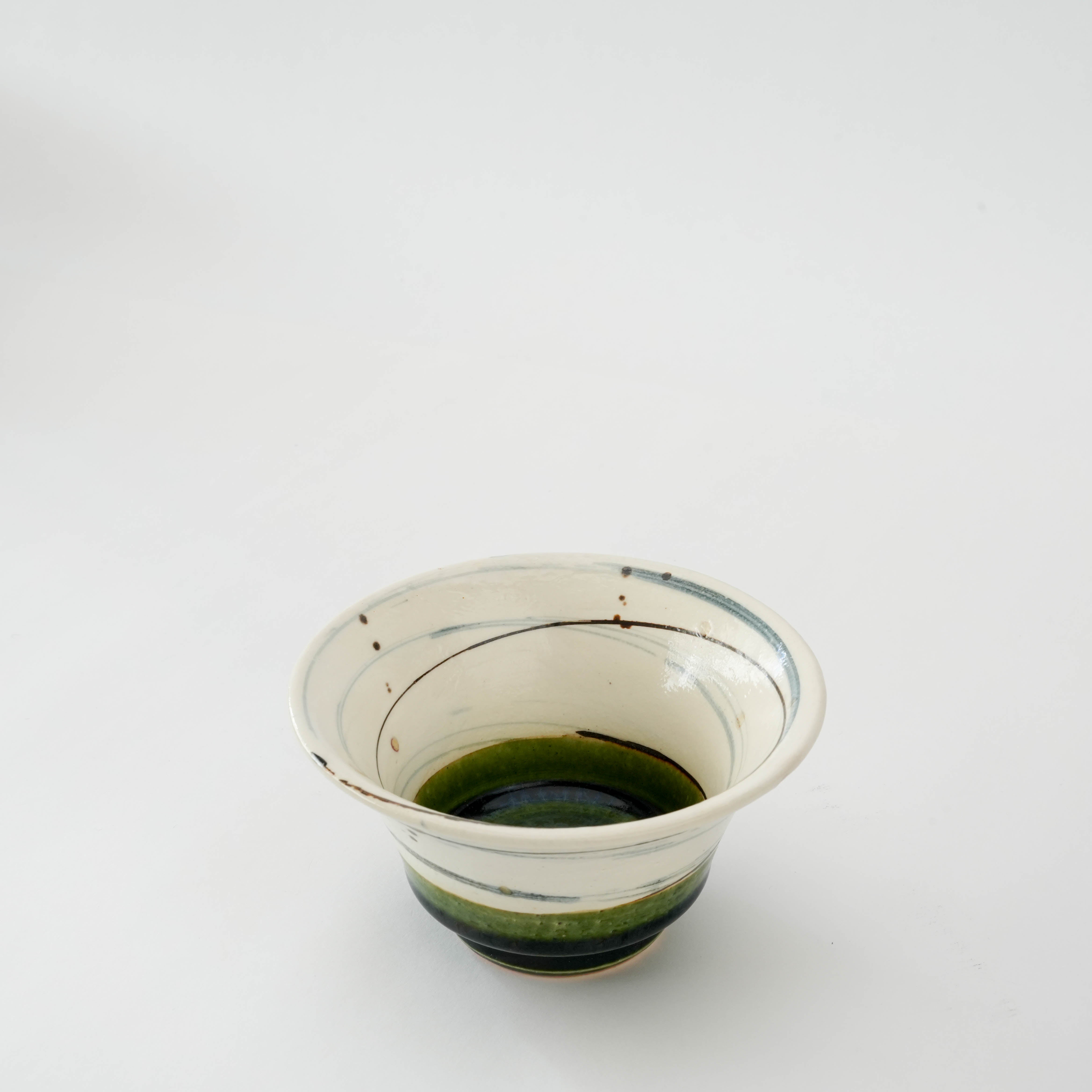 Top view of Mino Ware Oribe Spiral Small Bowl showing intricate hand-painted spiral and glossy green glaze, perfect for serving desserts or rice.
