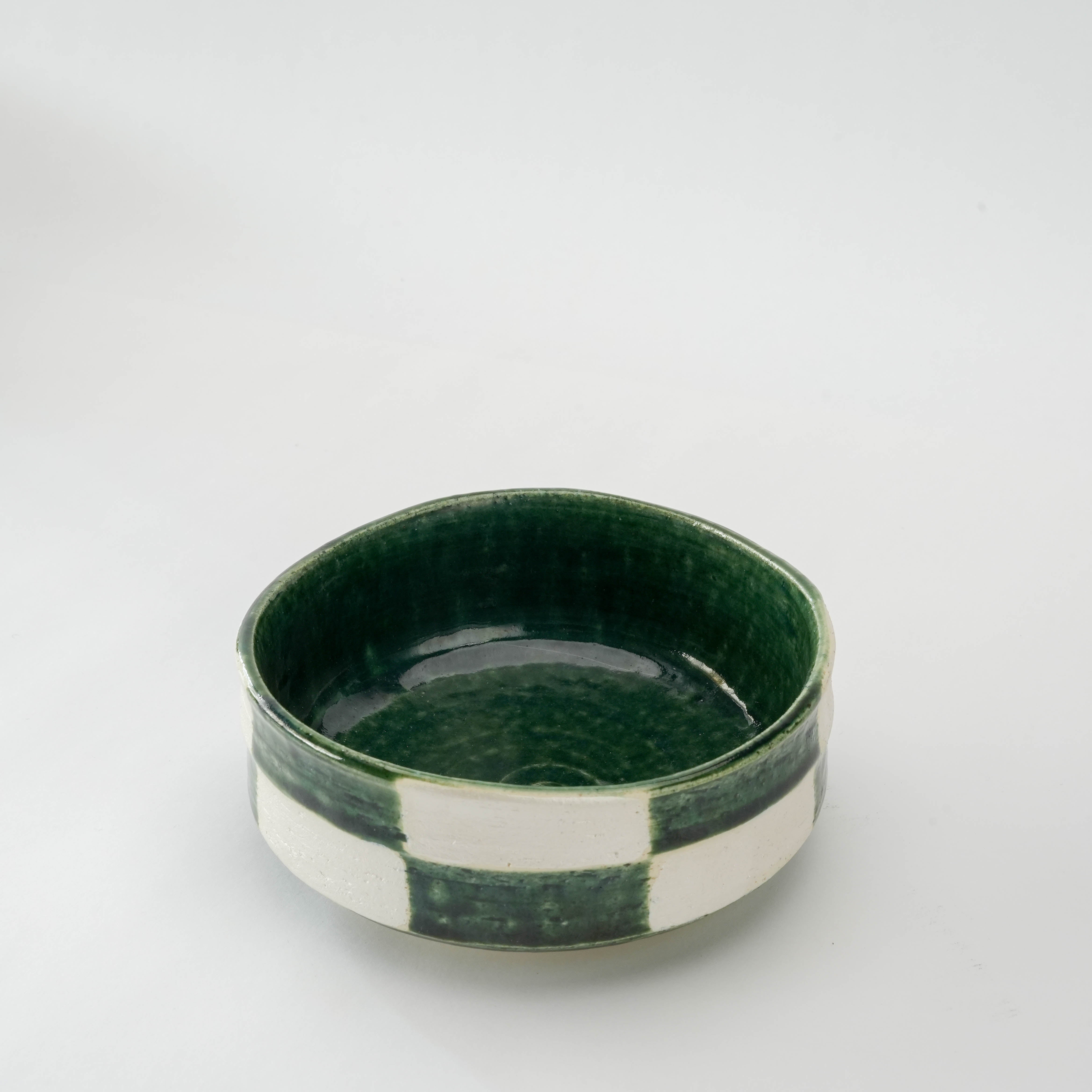 Top view of Mino Ware Ginsai Oribe Ichimatsu Kiritsuke Bowl showcasing glossy green interior and traditional Japanese craftsmanship.