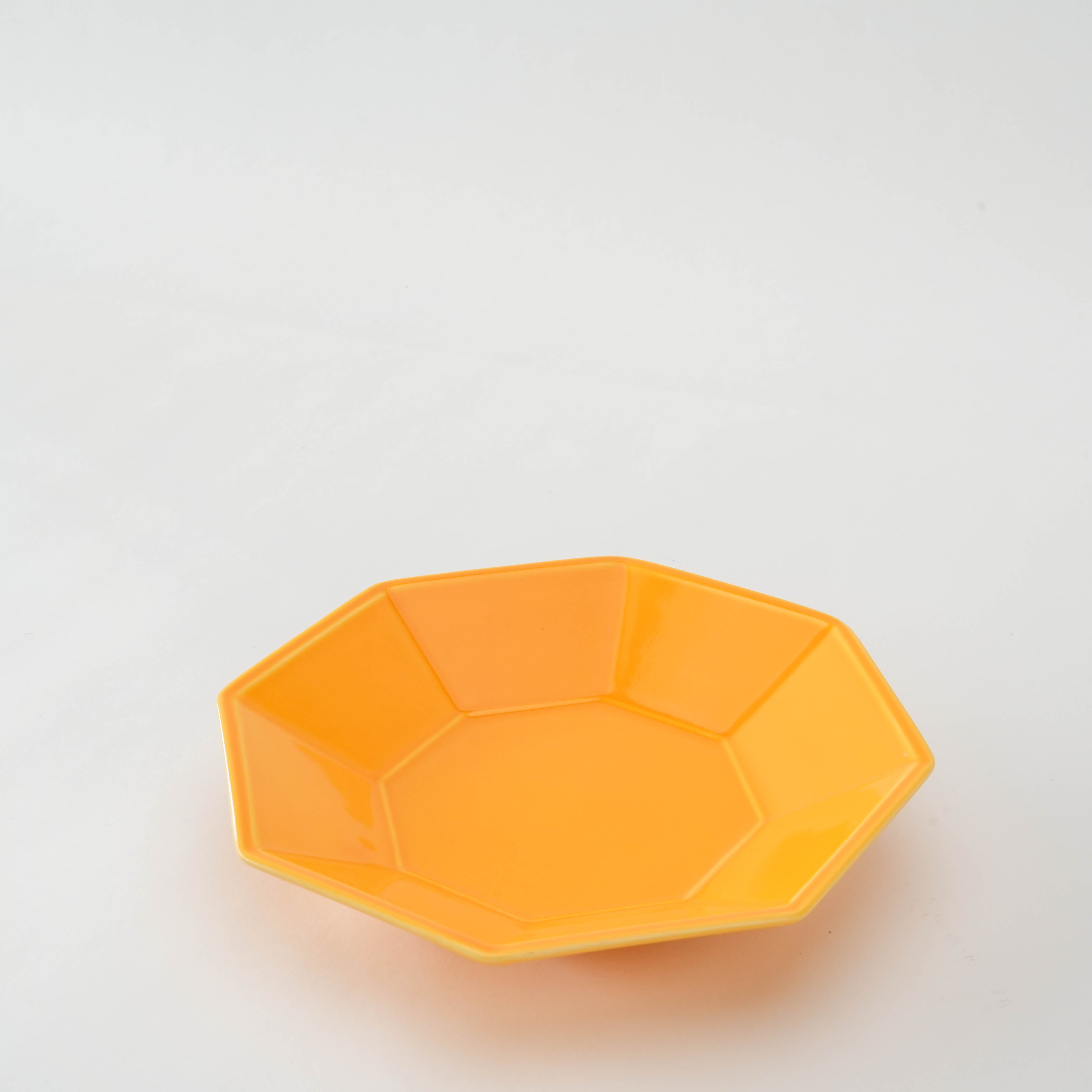 Mino Ware Yellow Glaze Octagonal Plate angled to show depth and geometric elegance, ideal for stylish everyday or festive dining.