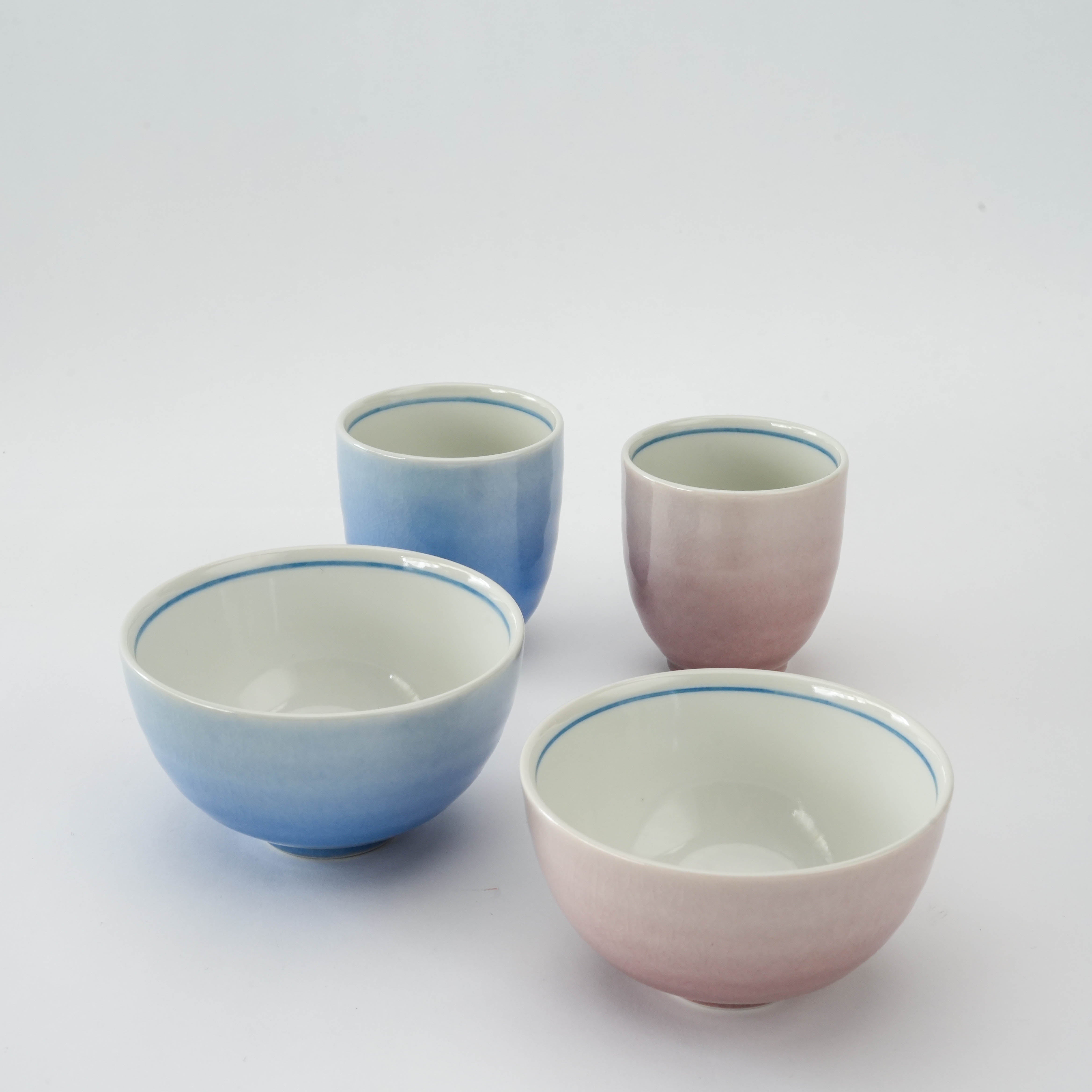 Kutani Ware Dinner Set - Blue Pink Porcelain | Kutani Craft features two rice bowls and two tea cups with a soft gradient glaze in blue and pink hues.