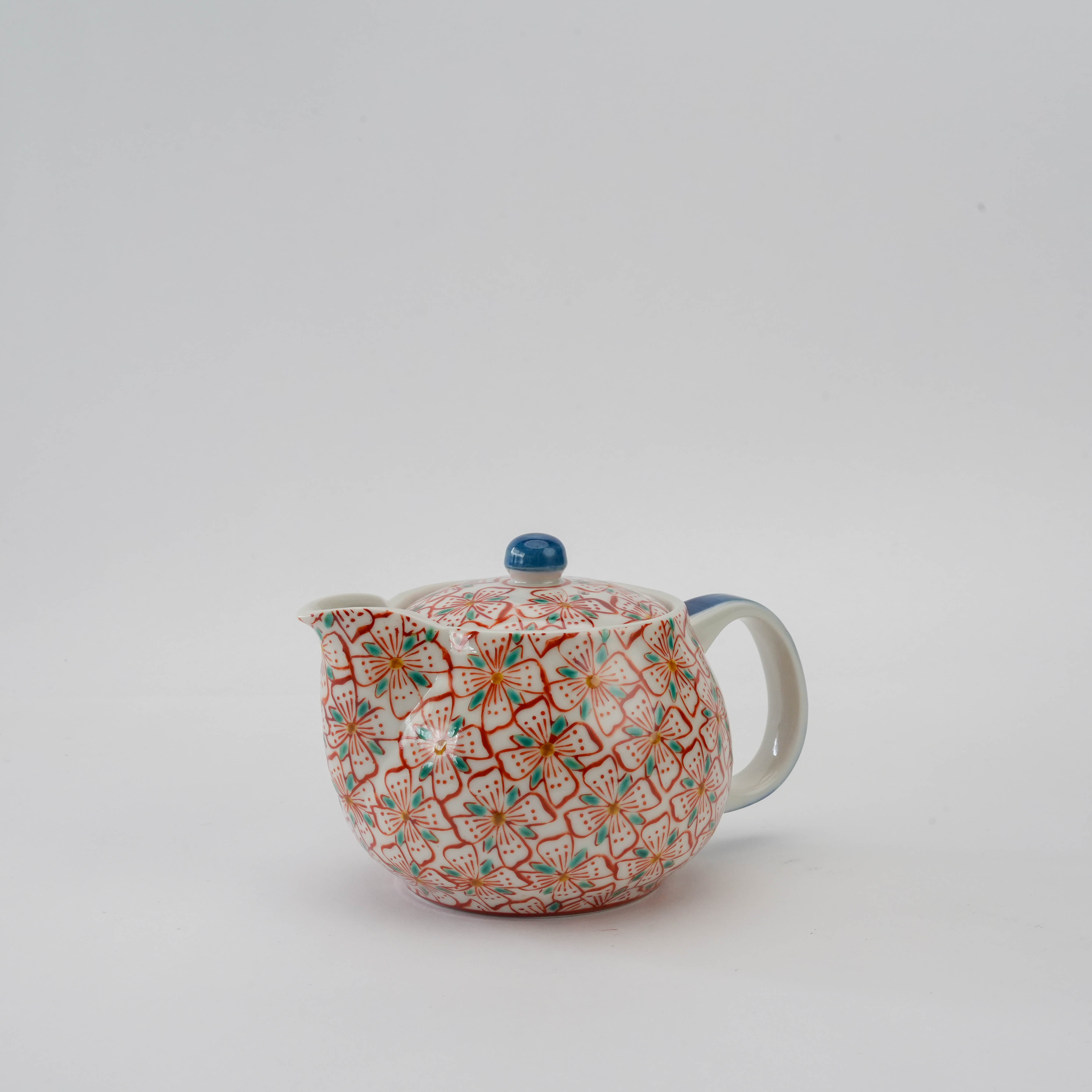 Kutani Ware Teapot - Red Blossom with hand-painted red and teal floral design, round porcelain body, and blue knob lid for tea lovers.