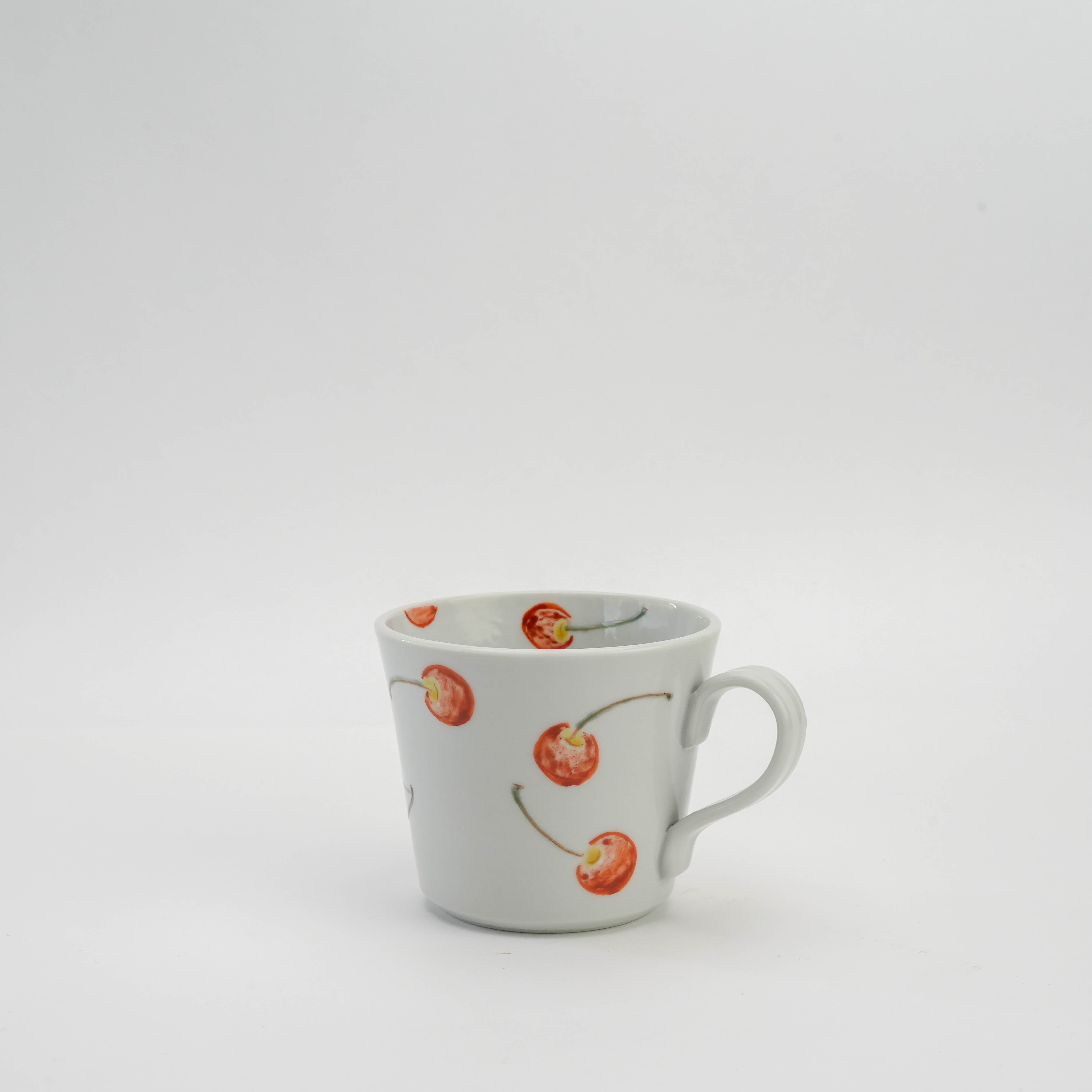 Kutani Ware Cherry Pattern Mug with red cherry motif on white porcelain, ideal for stylish everyday drinkware in kitchen and dining settings.