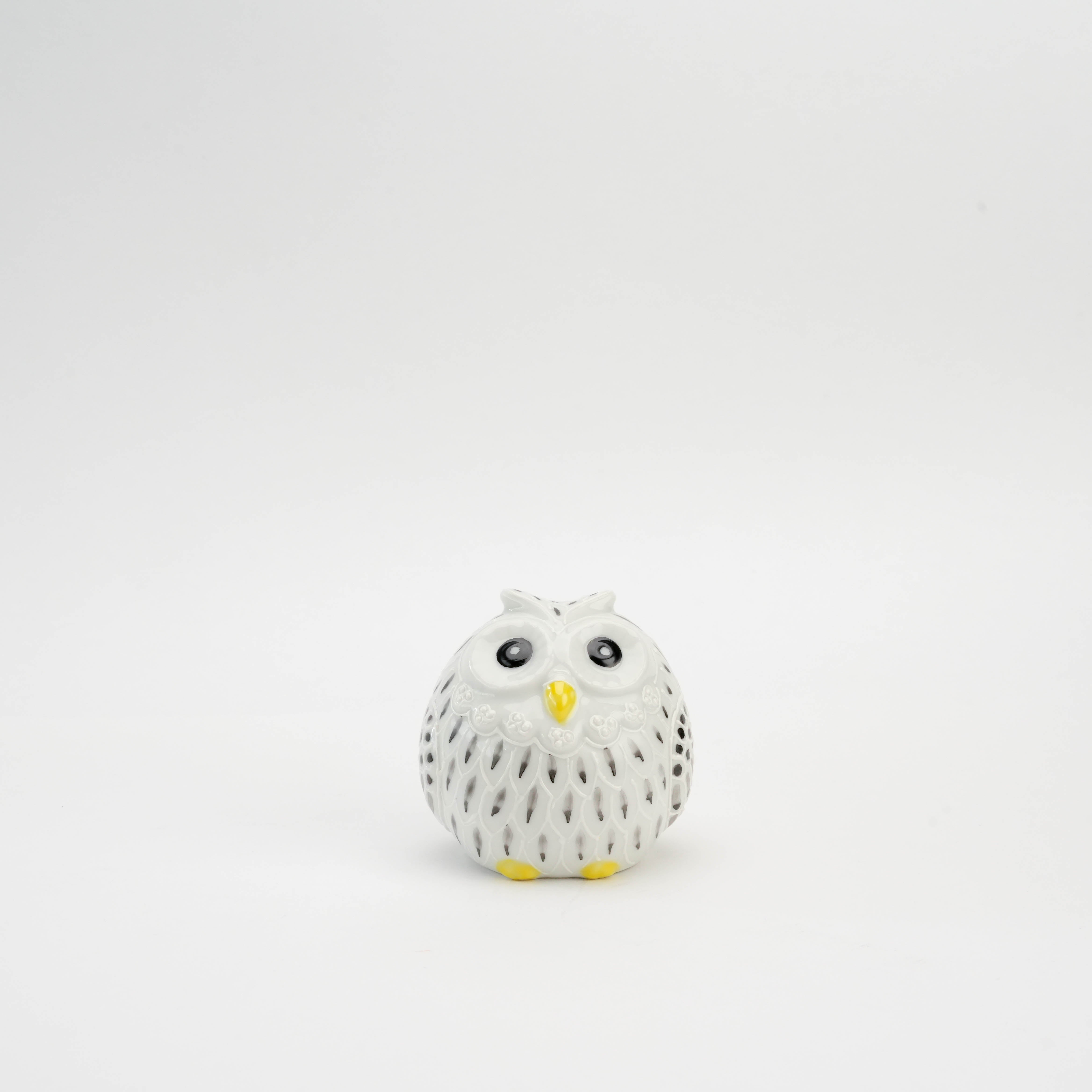 Kutani Owl Figurine - White & Black Detailing featuring a round ceramic owl with intricate cutouts, ideal for home decor or gifting.