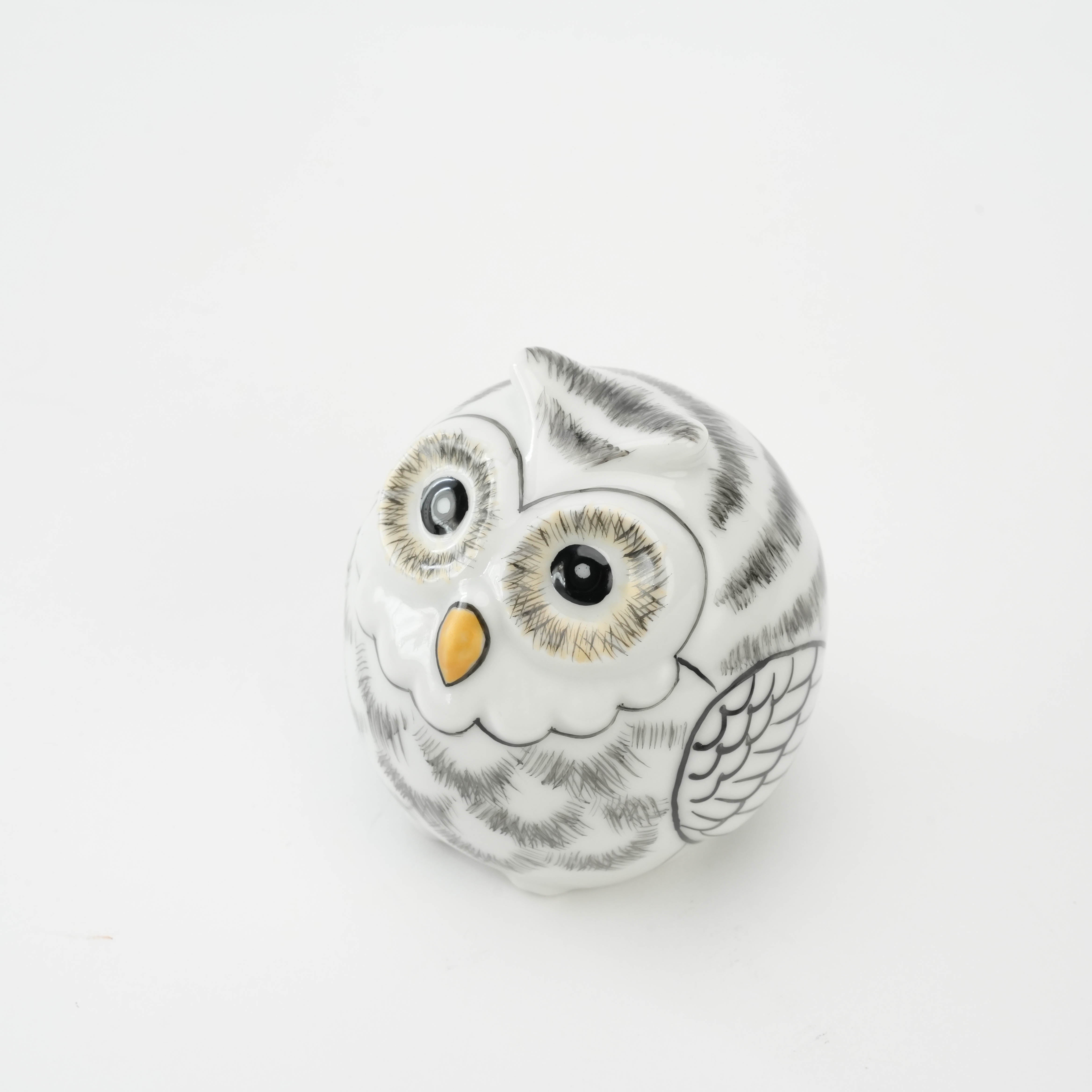 Porcelain Kutani Ware Owl Figurine viewed from an angle, showcasing intricate hand-painted feathers and expressive eyes for decorative charm.