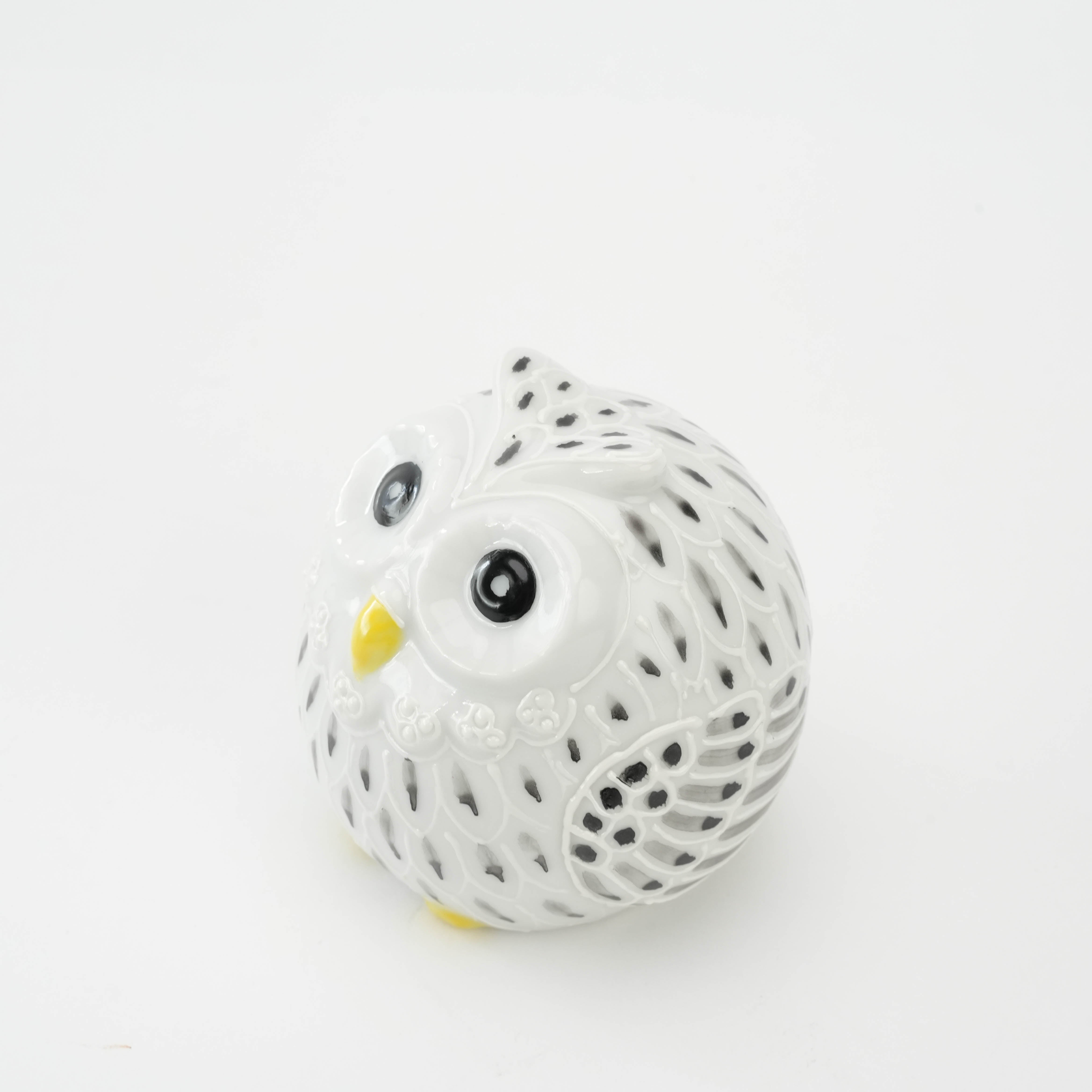 Top angled view of Kutani Ware Owl Figurine with glossy white glaze and black detailing, showcasing traditional Japanese craftsmanship.