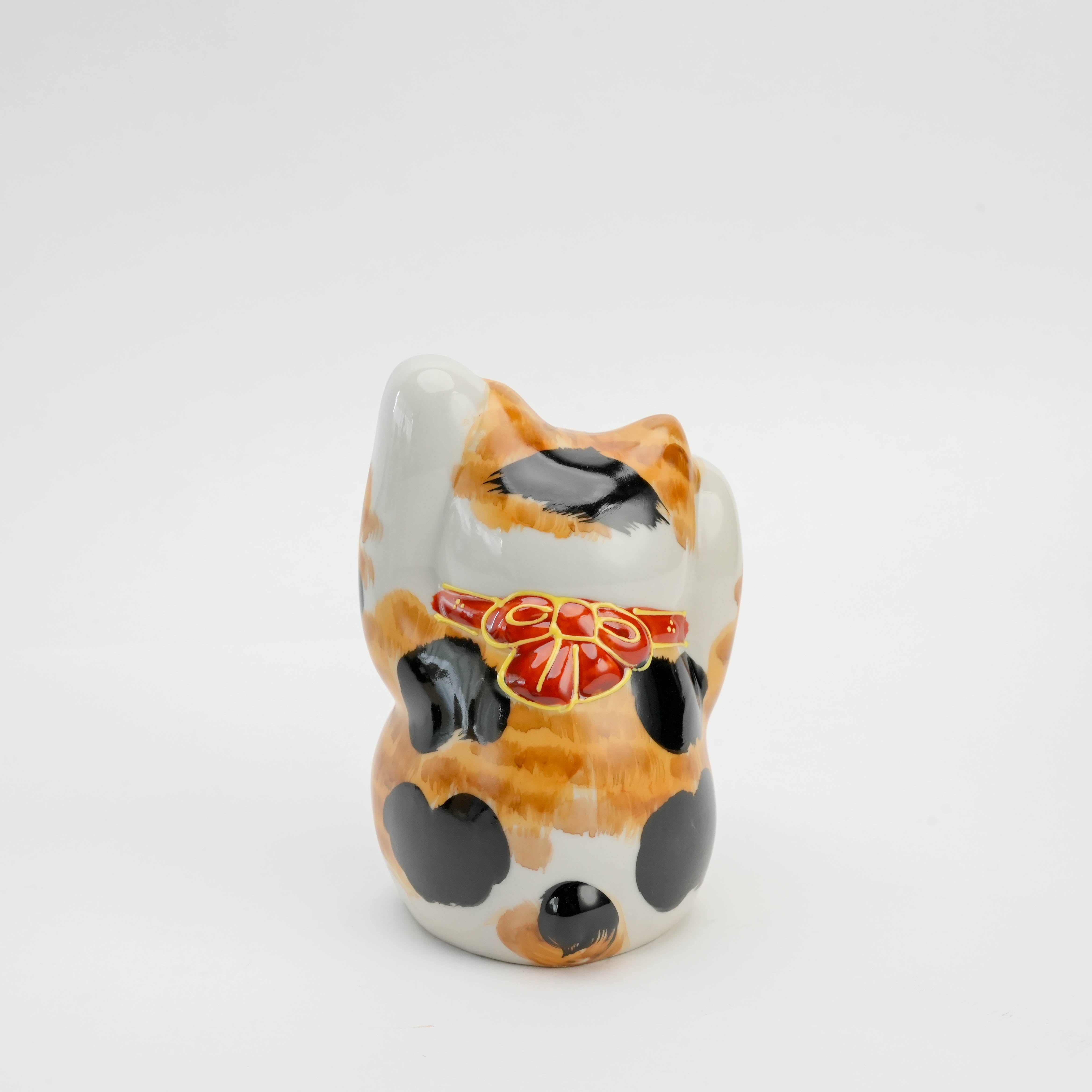 Back view of Kutani Ware Double-Paw Cat Ornament showing detailed calico fur pattern and red ribbon collar, ideal for home decor or gifting.