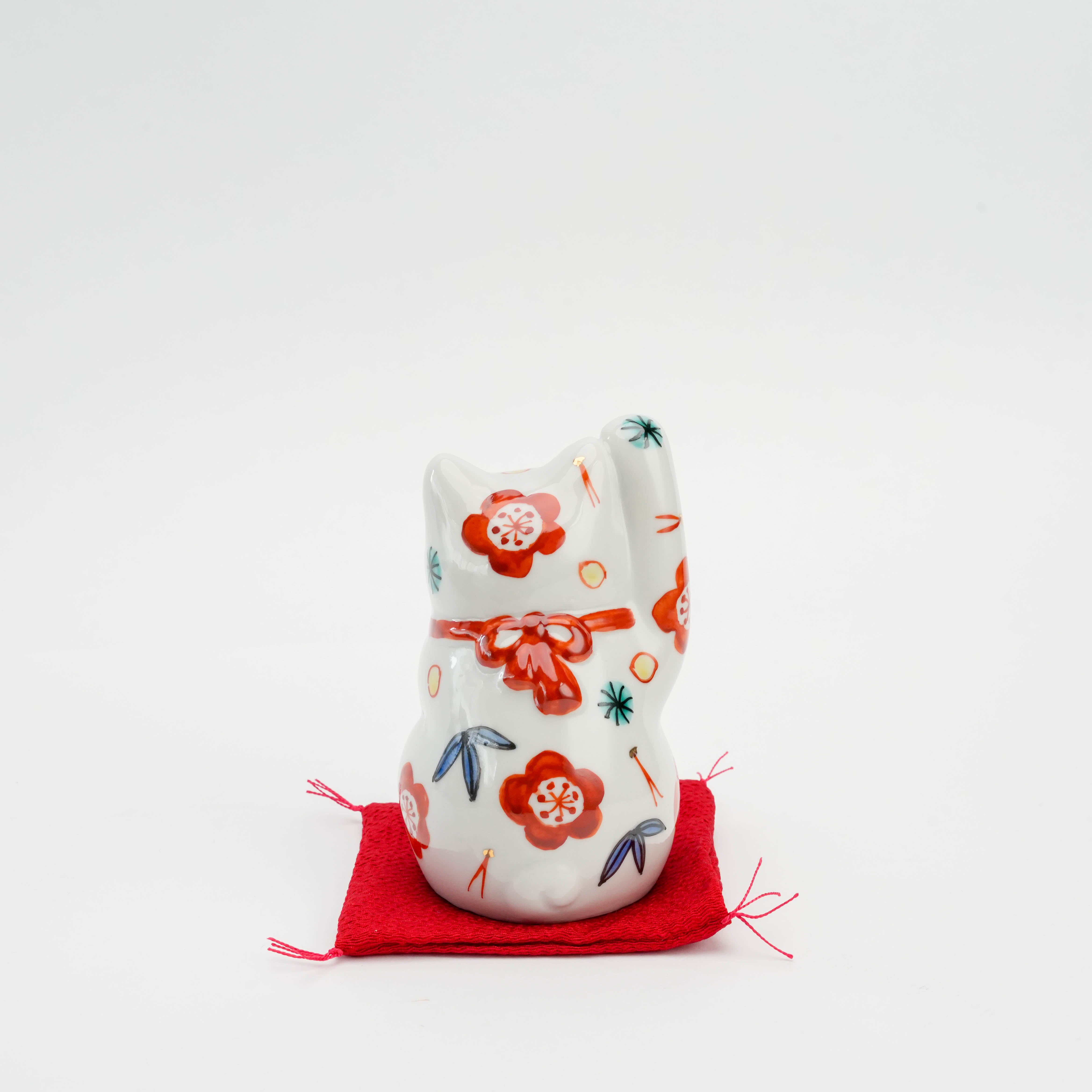 Back view of Kutani Ware Cat Ornament featuring plum, pine, and bamboo motifs, crafted in fine porcelain for home decor or gifting.