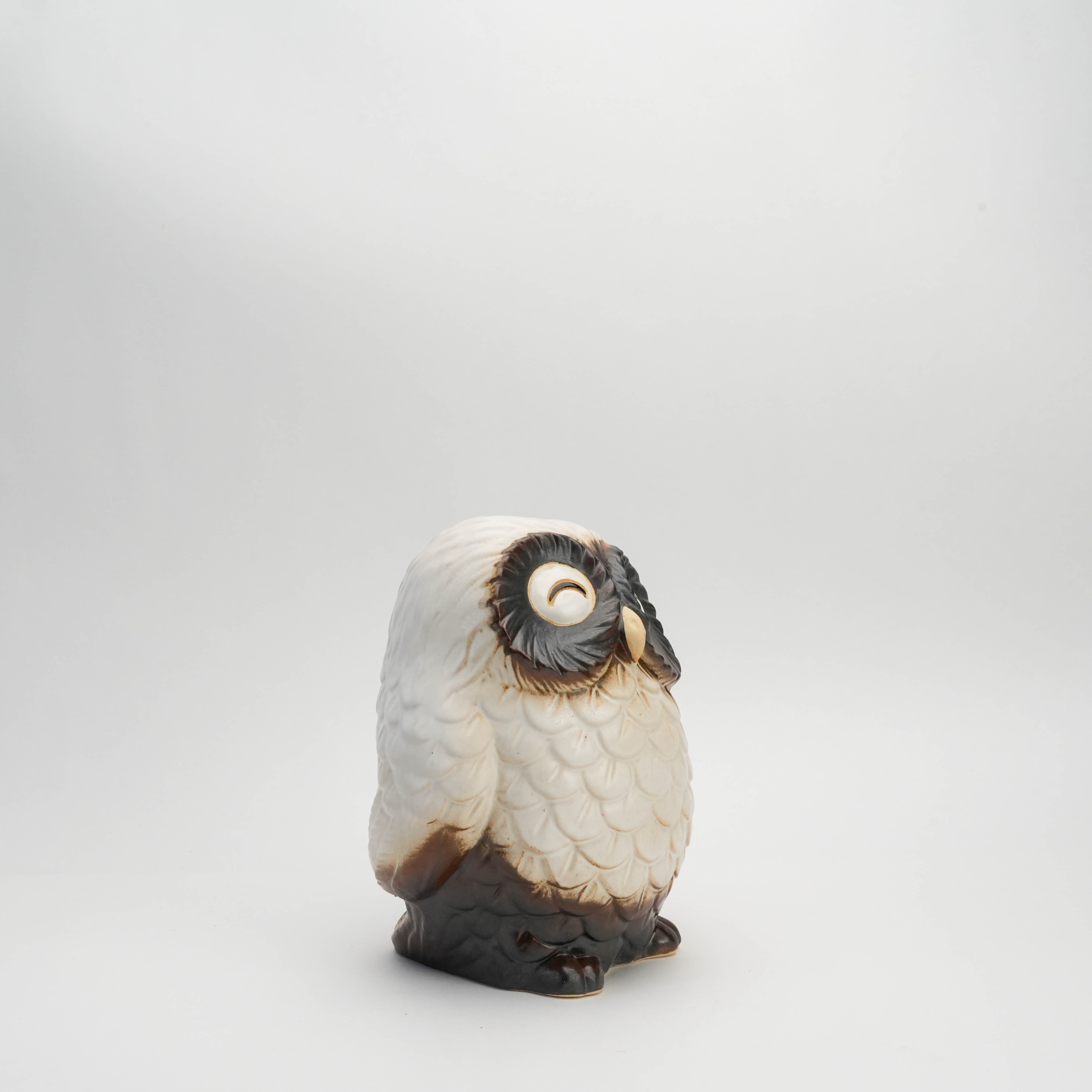 Side profile of large handcrafted Shigaraki Ware white owl ornament with textured feathers and a serene smiling face, perfect for home decor.