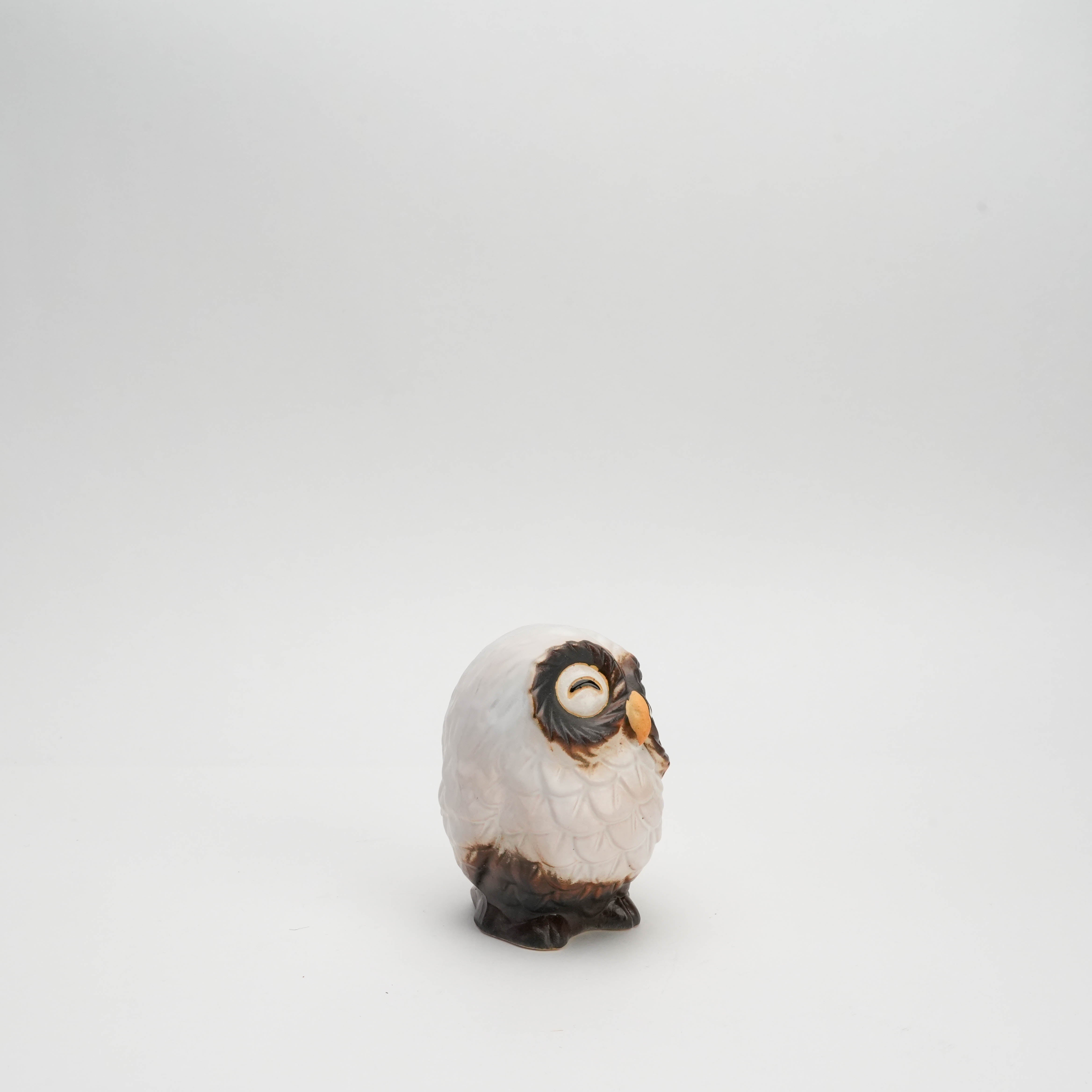 Side angle of small White Owl Ornament - Smiling Shigaraki, featuring hand-painted ceramic details and a whimsical expression.