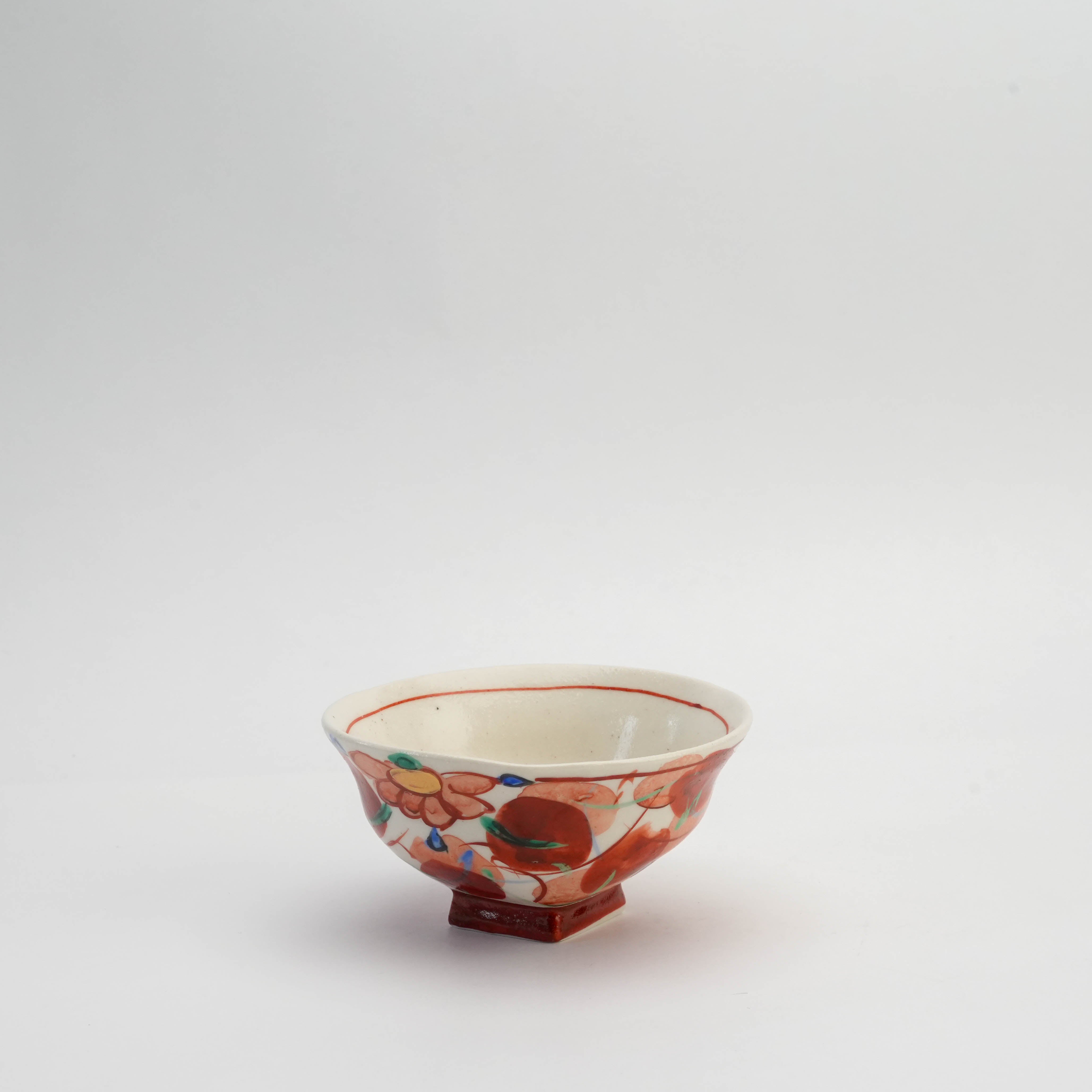 Traditional Japanese Mino Ware rice bowl featuring Akae Konoha design with vibrant floral patterns and a unique square base for added charm.
