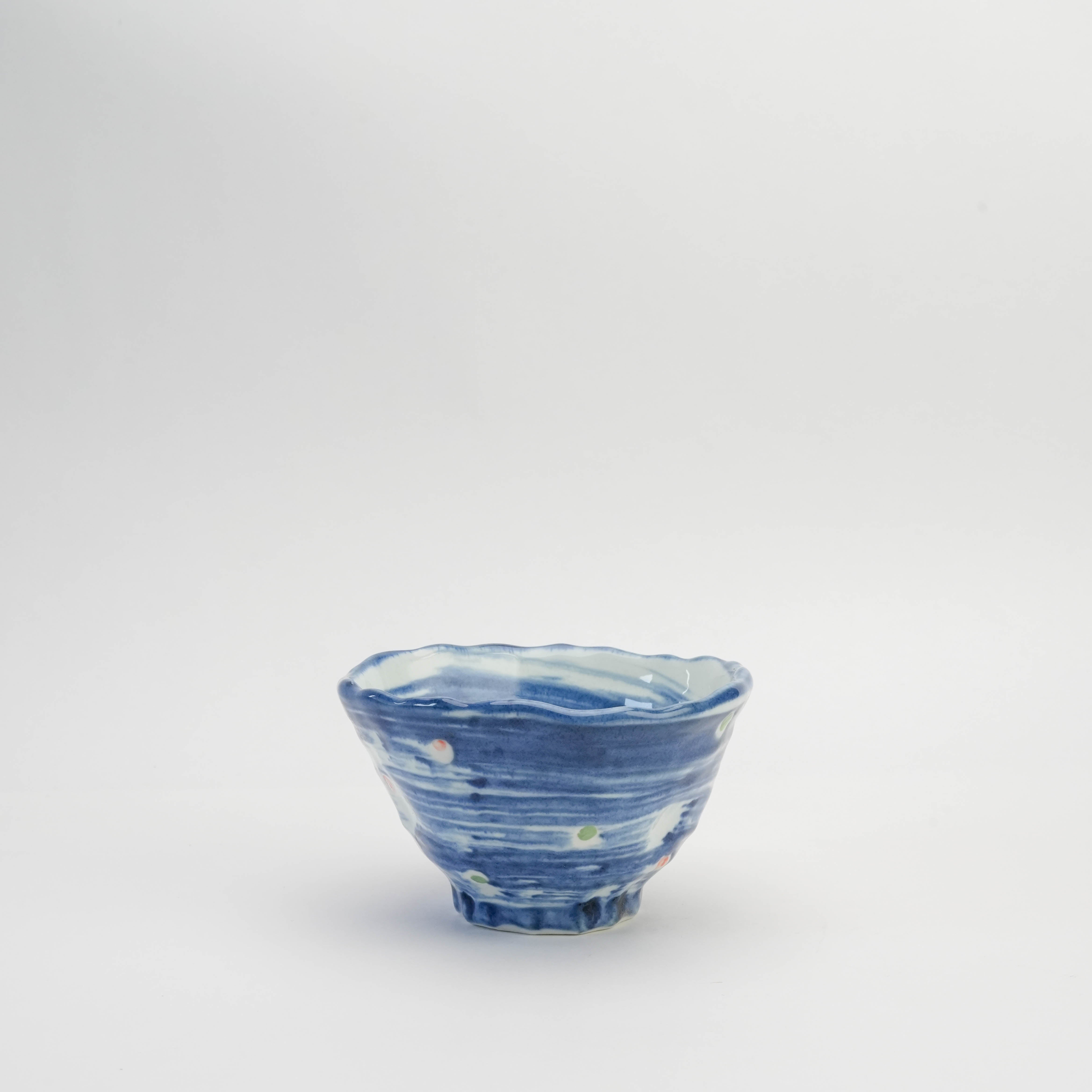 Tri-pressed Mino Ware Donburi Bowl in deep indigo with hand-painted polka dots, perfect for serving Japanese meals in stylish dinnerware.