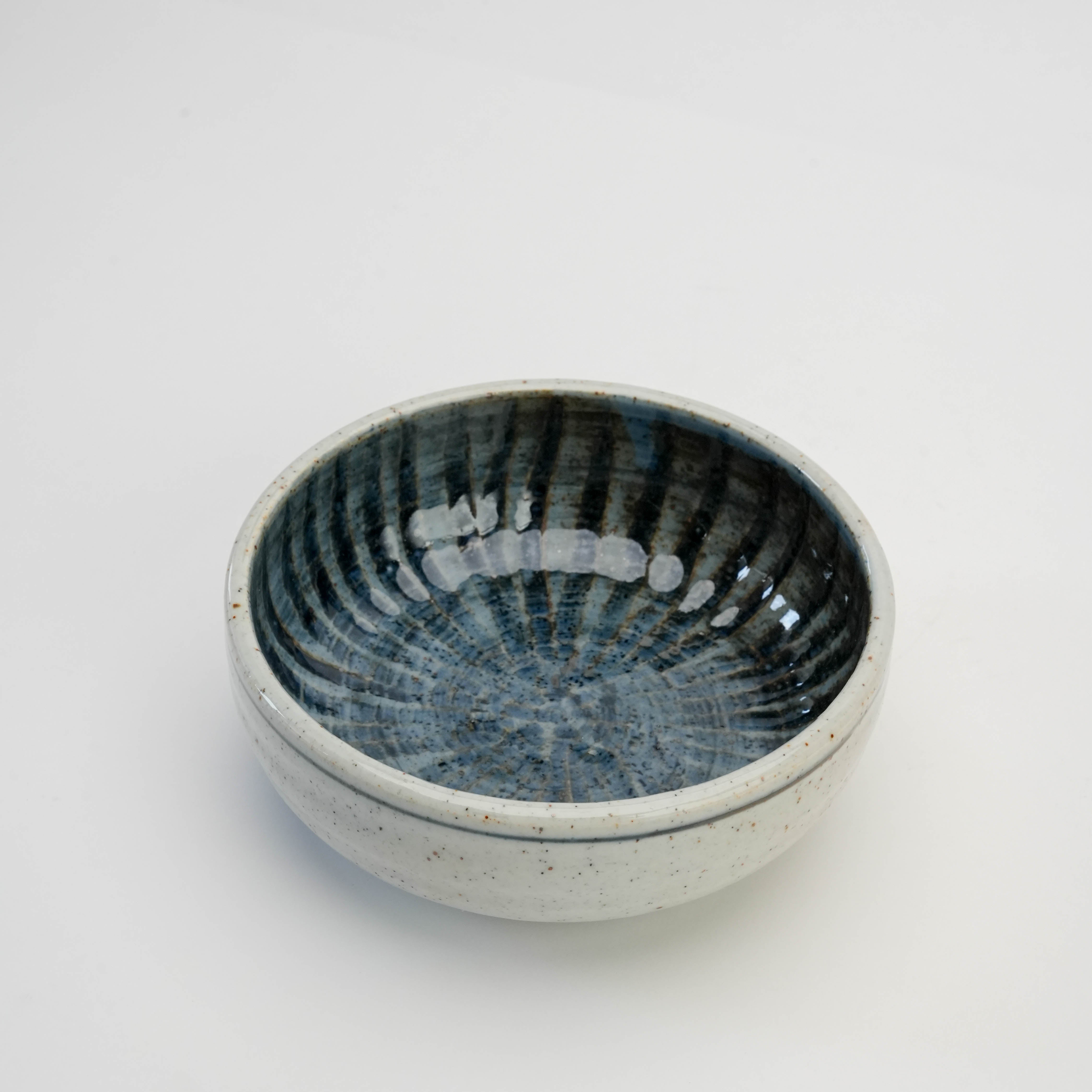 Top view of Mino Ware Ishiyaki Bowl showcasing gosu-maki glaze and deep indigo spiral interior, perfect for versatile tableware use.