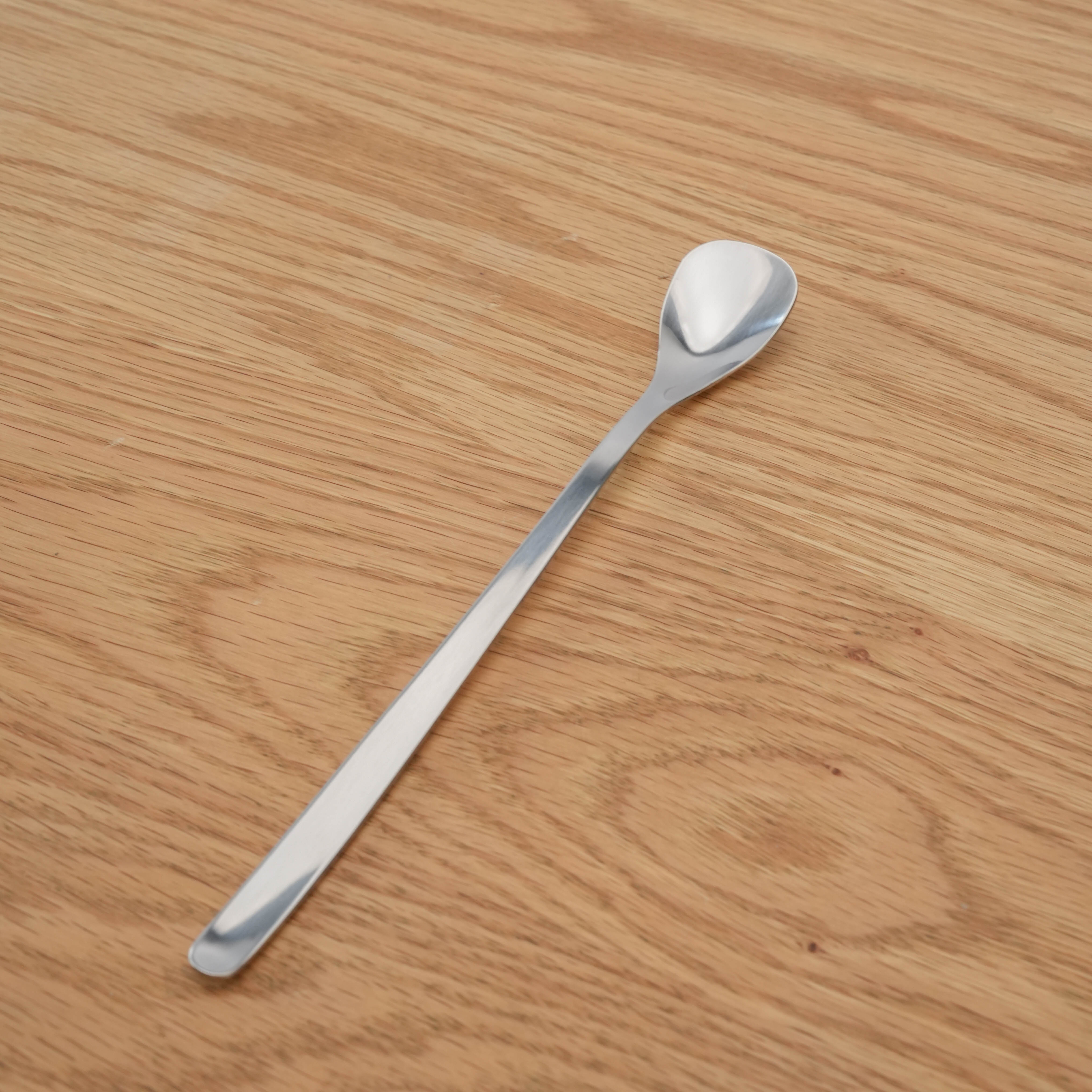 Sori Yanagi Parfait Spoon - Stainless Steel | Japan, 185mm displayed on wooden surface, showcasing its sleek, minimalist design.