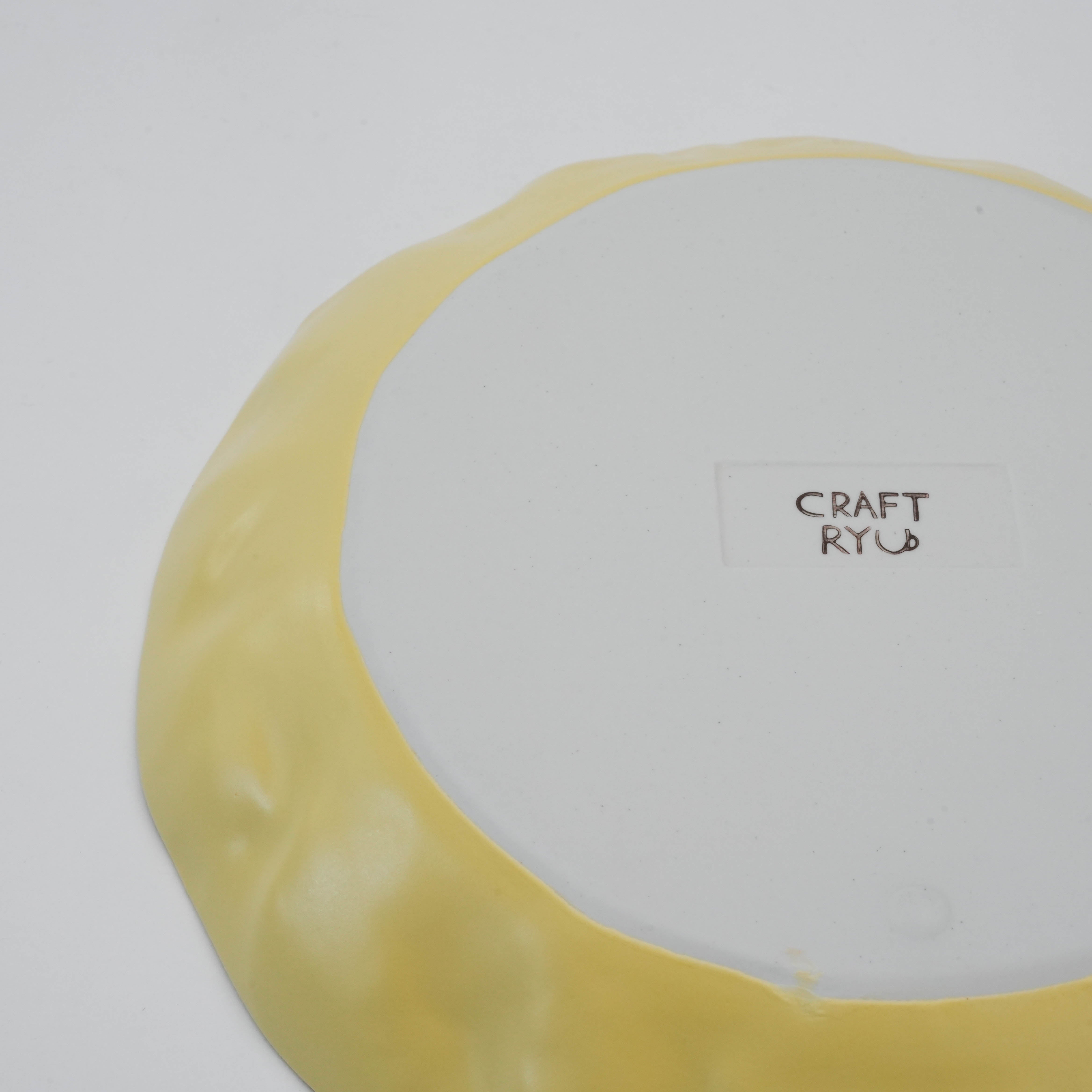 Bottom view of yellow Hasami Ware Papyrus Dish with 'CRAFT RYU' branding, showcasing its artisanal ceramic craftsmanship.