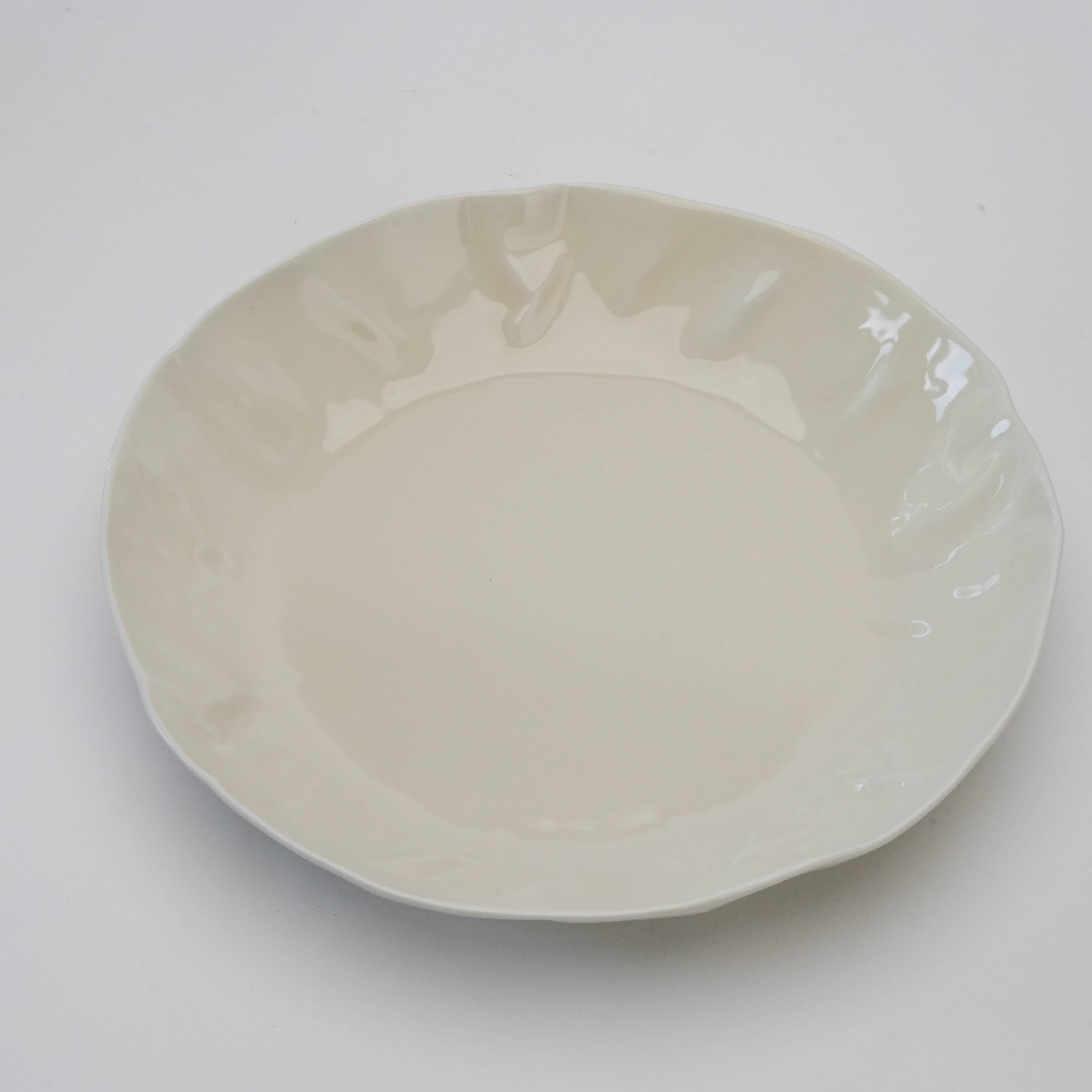 Top view of white Hasami Ware Papyrus Curry Dish with elegant, rippled rim design ideal for serving pasta or curry dishes.