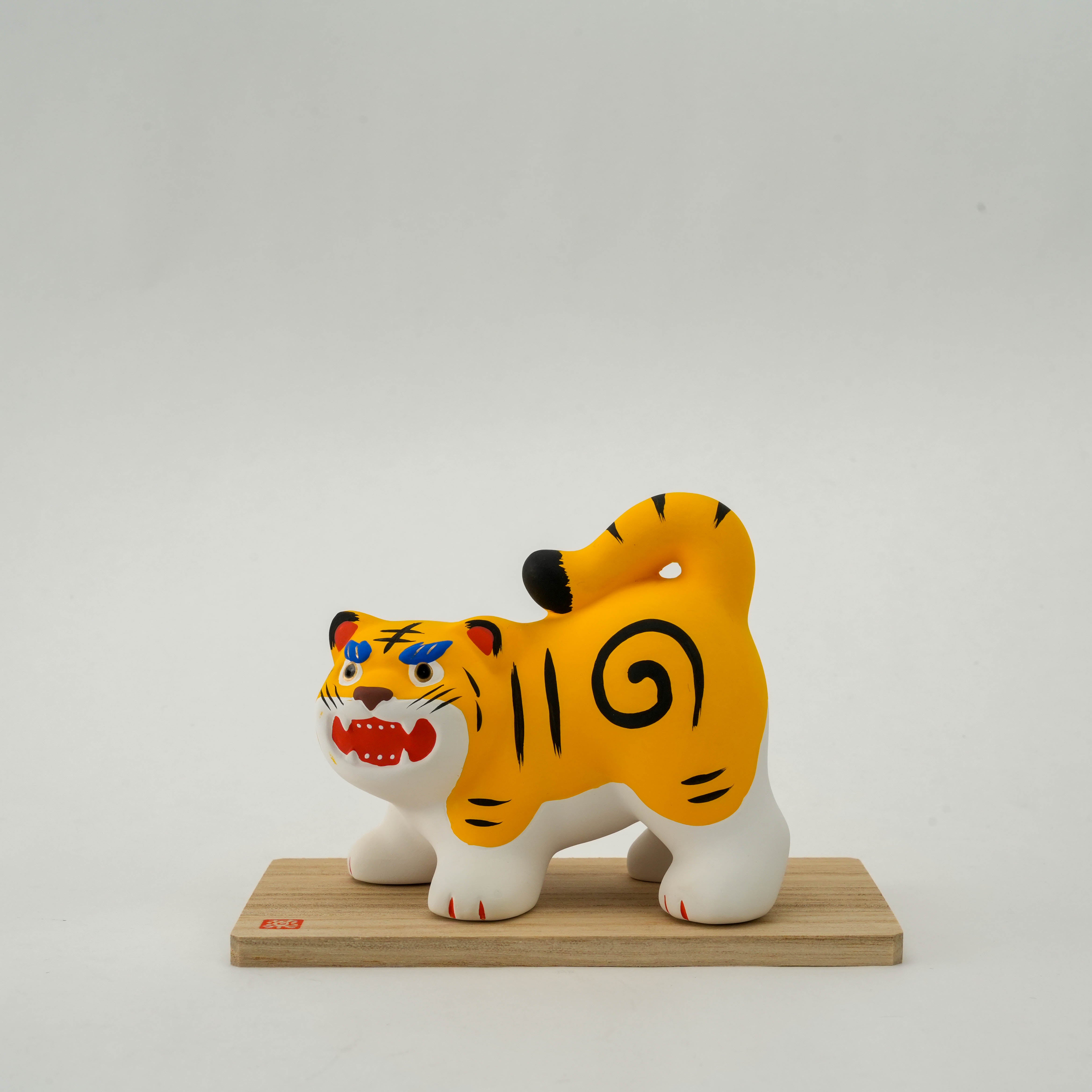 Front-facing Yakushigama Tiger Ornament with vibrant colors and handcrafted ceramic detail, ideal for spirited home décor or gifting.