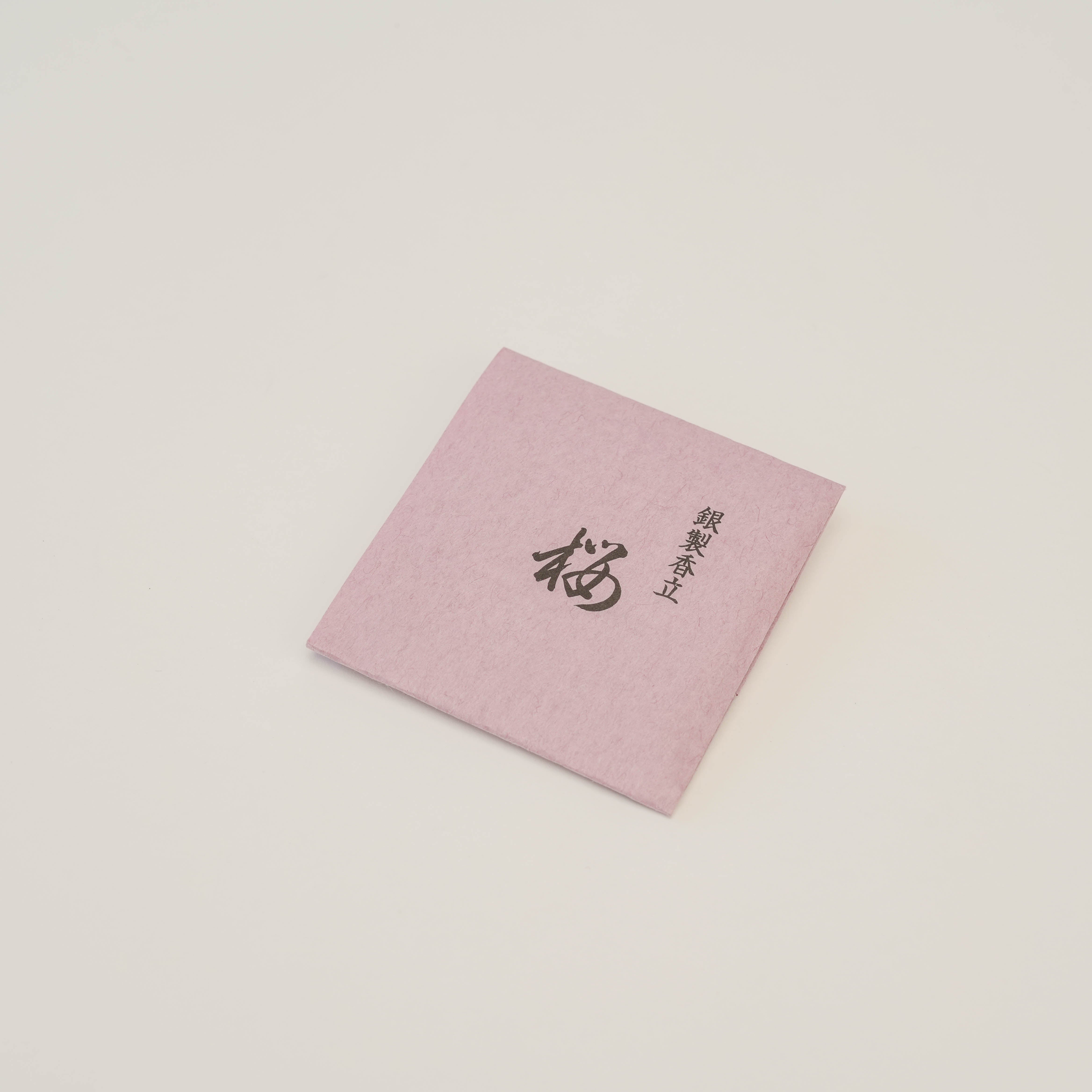 Shoyeido Silver Incense Holder - Cherry Blossoms packaging in soft pink with Japanese calligraphy. Perfect for gifting or luxury home fragrance.