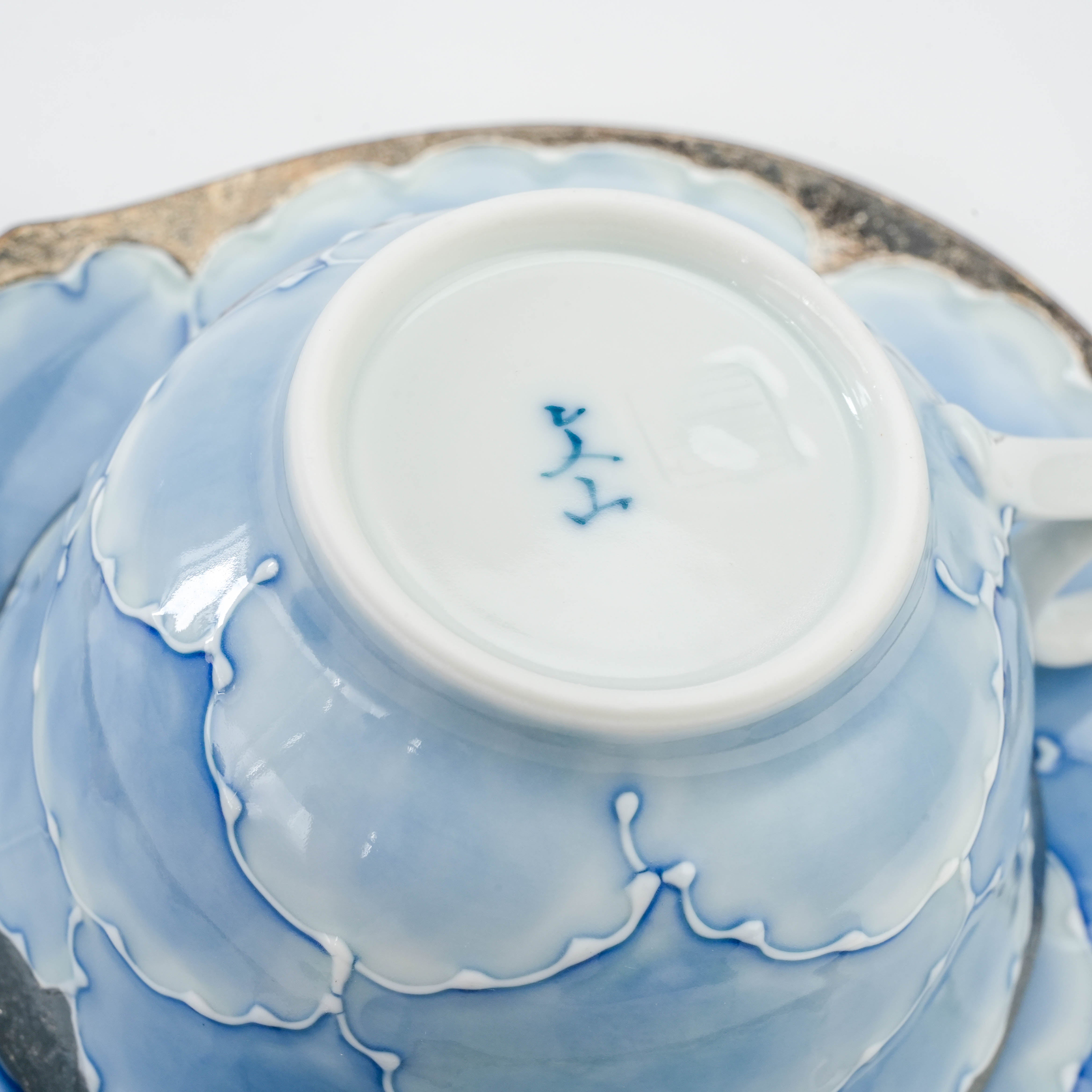 Bottom of Bunzan Kiln Arita Peony Cup showing kiln mark and smooth porcelain finish, emphasizing authenticity and handcrafted quality.