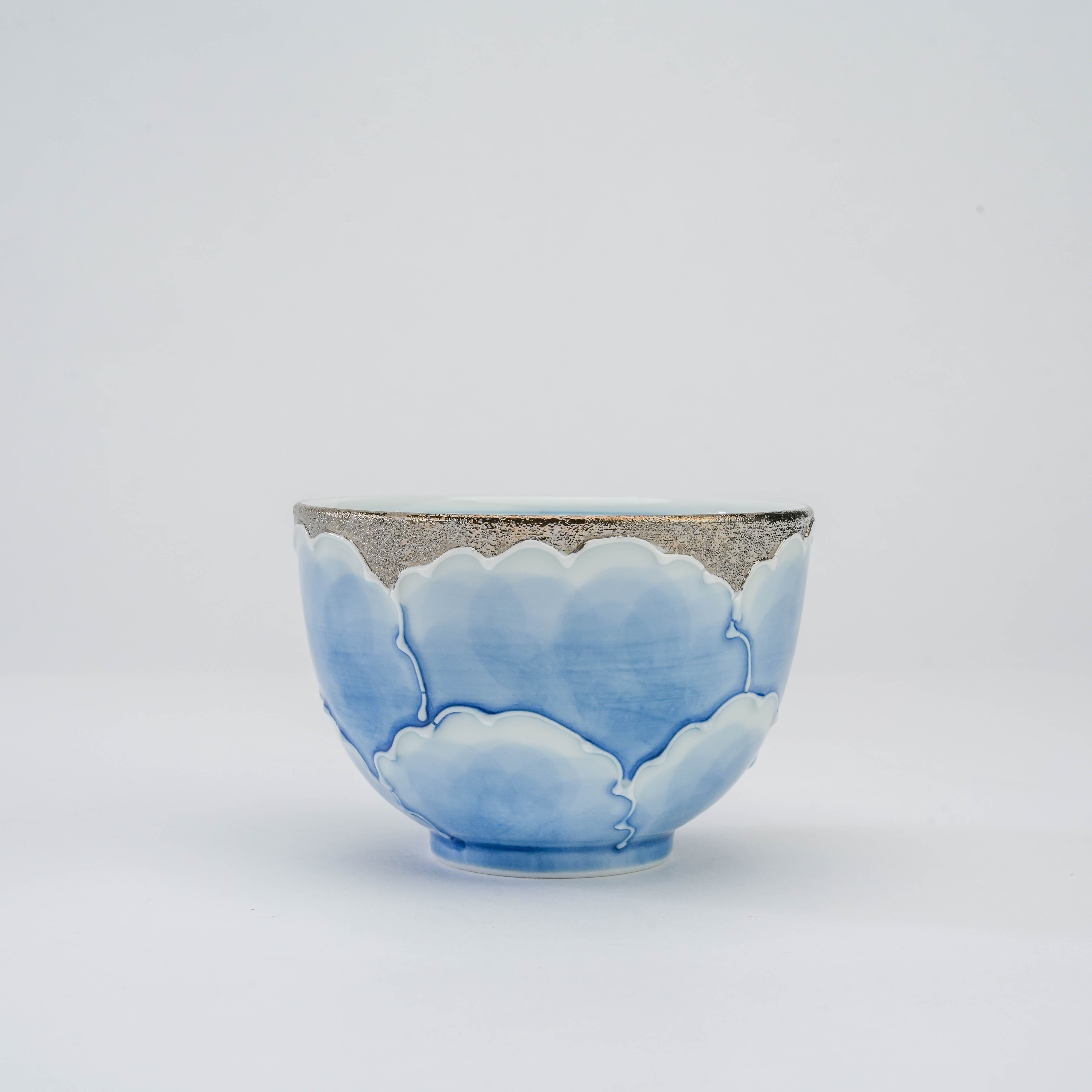 Side profile of Peony Tea Cup - Bunzan Kiln | Platinum Series Arita Ware with hand-painted blue petals and shimmering silver accents.