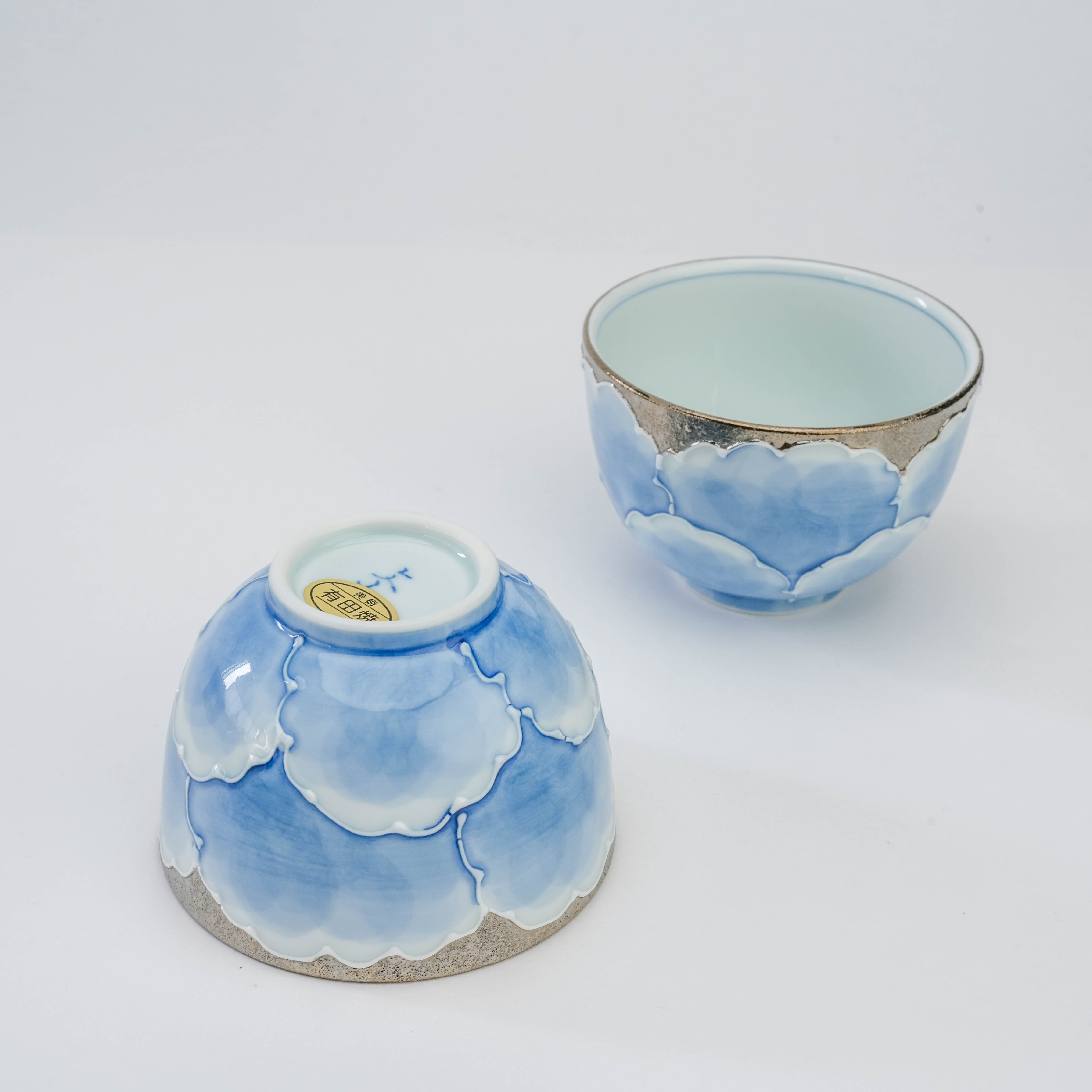 Bottom view of Arita Ware Peony Tea Cup showing kiln mark and sticker, highlighting craftsmanship of Bunzan Kiln’s Platinum Series.