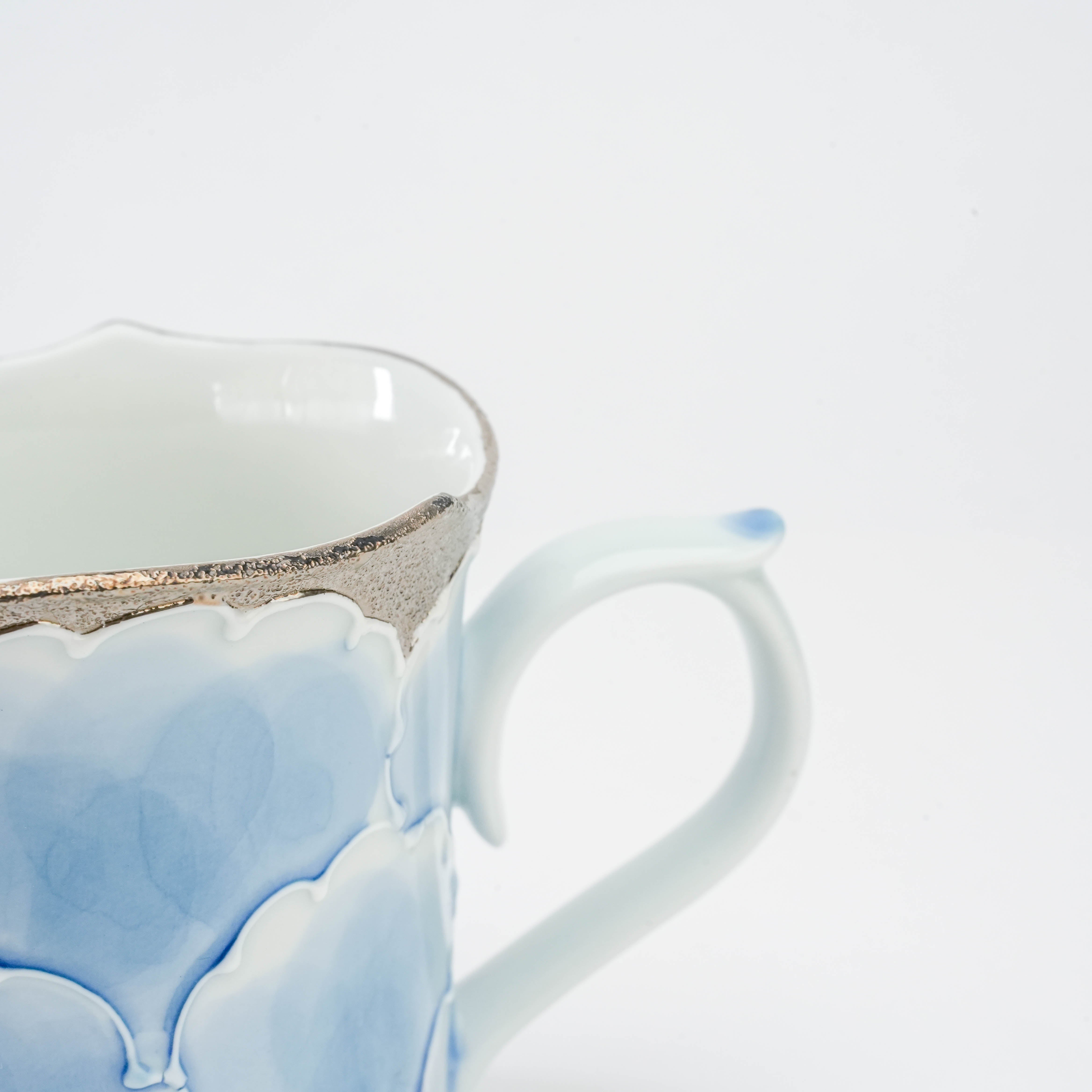 Handle and rim detail of the Arita Ware Peony Mug Blue Silver, highlighting the delicate hand-painted design and metallic finish.