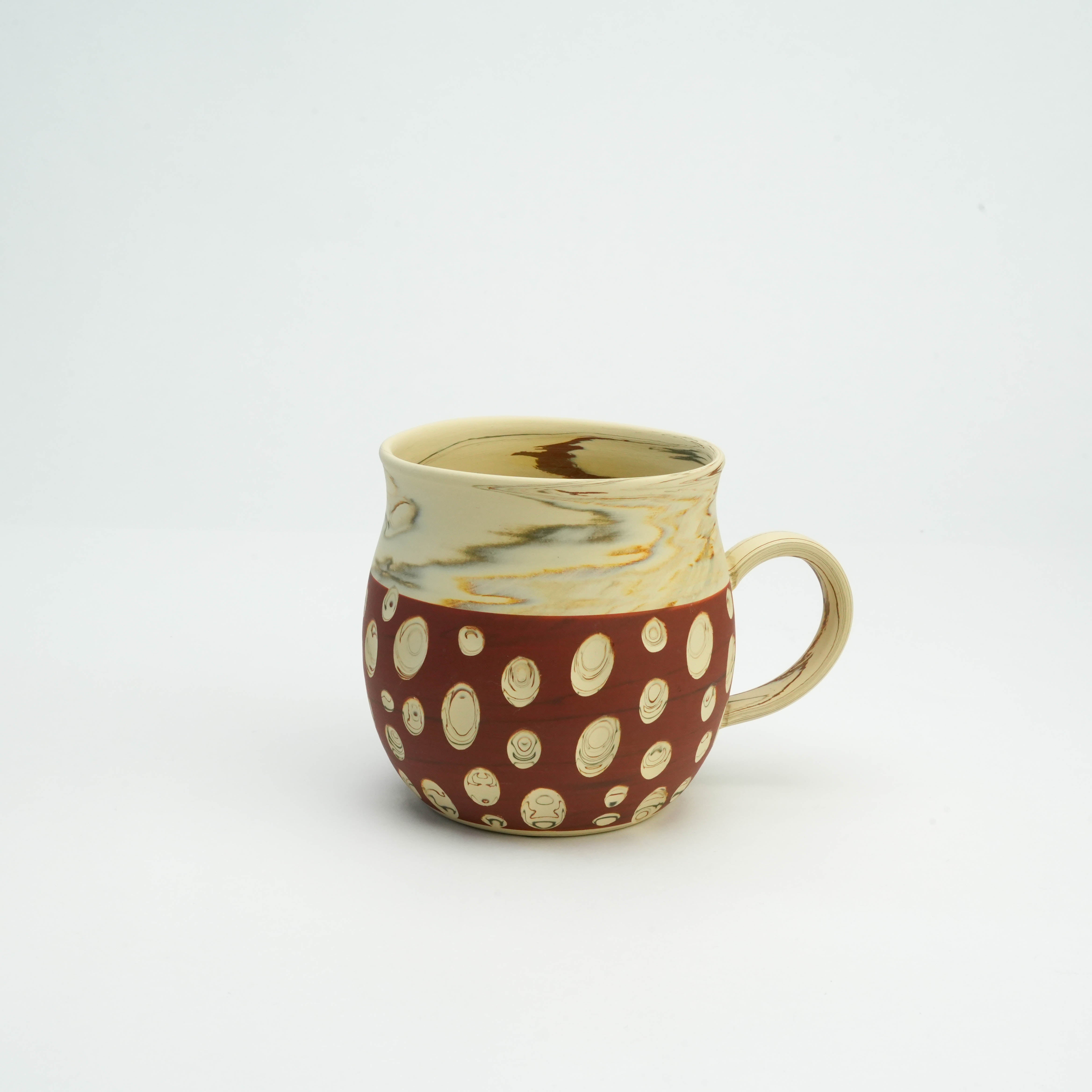 Tokoname Ware Mug Red - Polka Dot Design by Kenji Touen, featuring a round shape with marbled cream top and red base with carved dots.