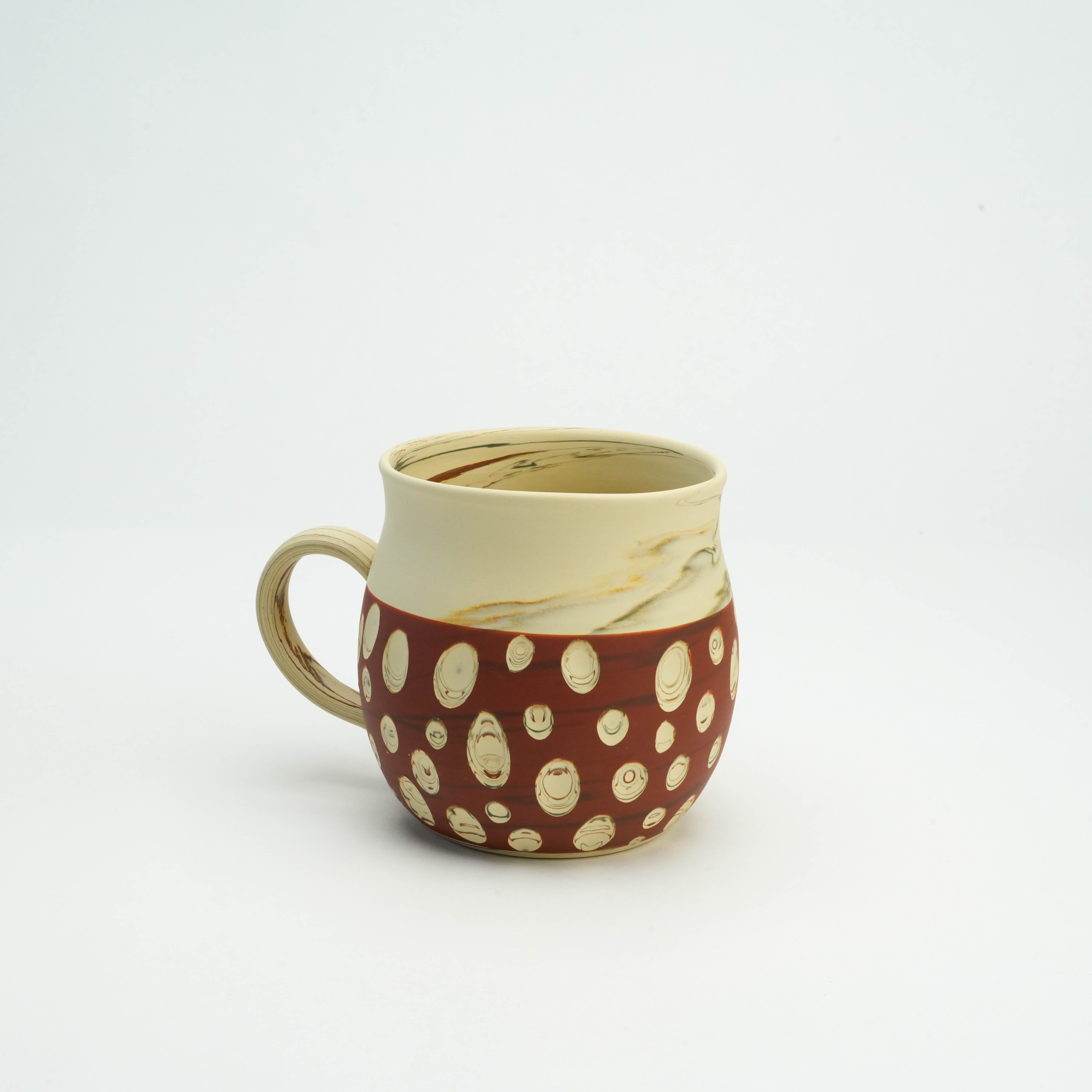 Handcrafted Tokoname Ware Polka Dot Mug in red by Kenji Touen, showcasing Japanese ceramic artistry with a smooth, curved form.