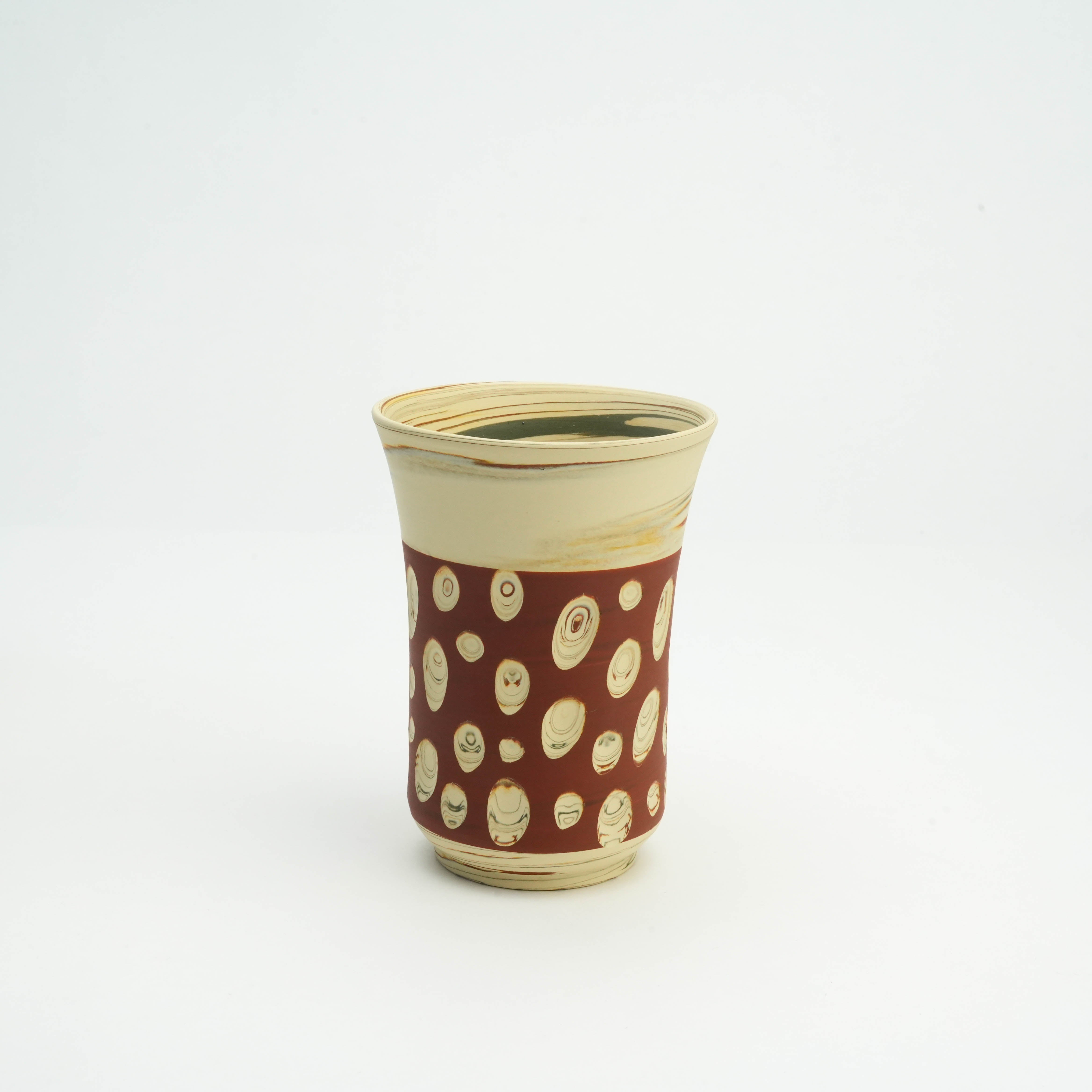 Angled view of Tokoname Ware Red Tumbler with handcrafted cream and red polka dots, perfect for modern kitchen and dining decor.