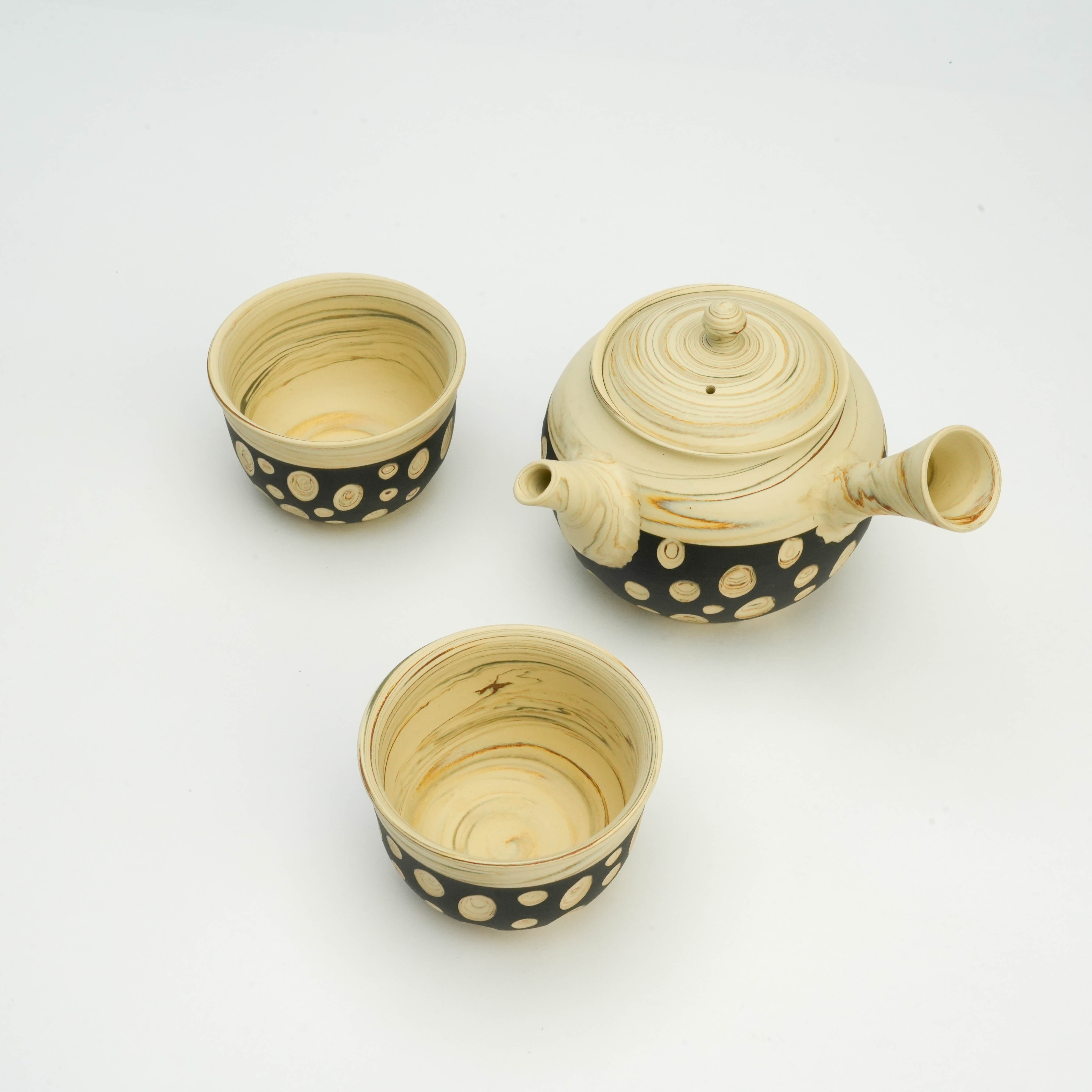 Top view of Tokoname Ware Polka Dot Tea Set showing the teapot and cups with swirling nerikomi textures and bold polka dot design.