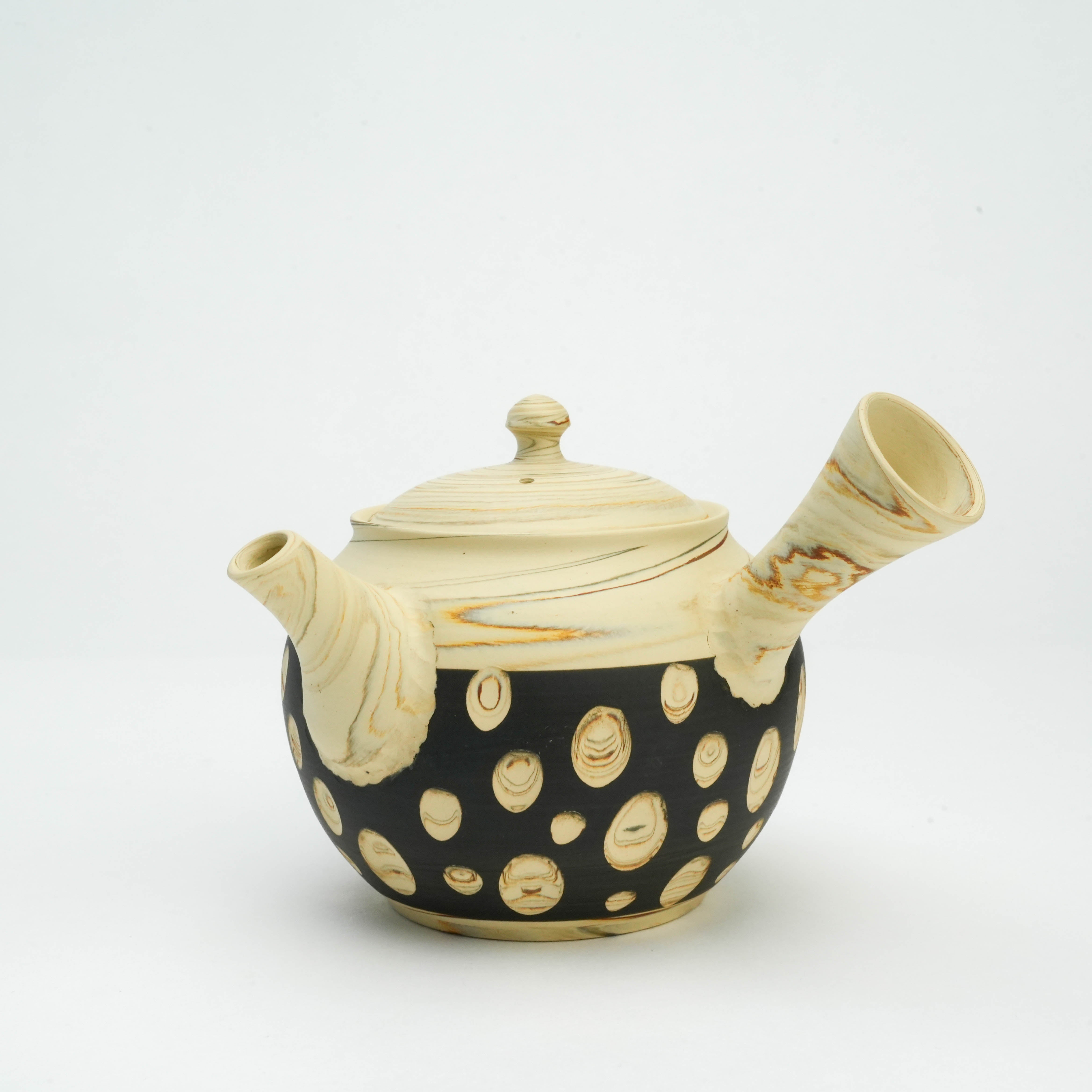 Close-up of Tokoname Polka Dot Teapot with side handle and intricate nerikomi polka dot detailing, crafted by Kenji Touen.