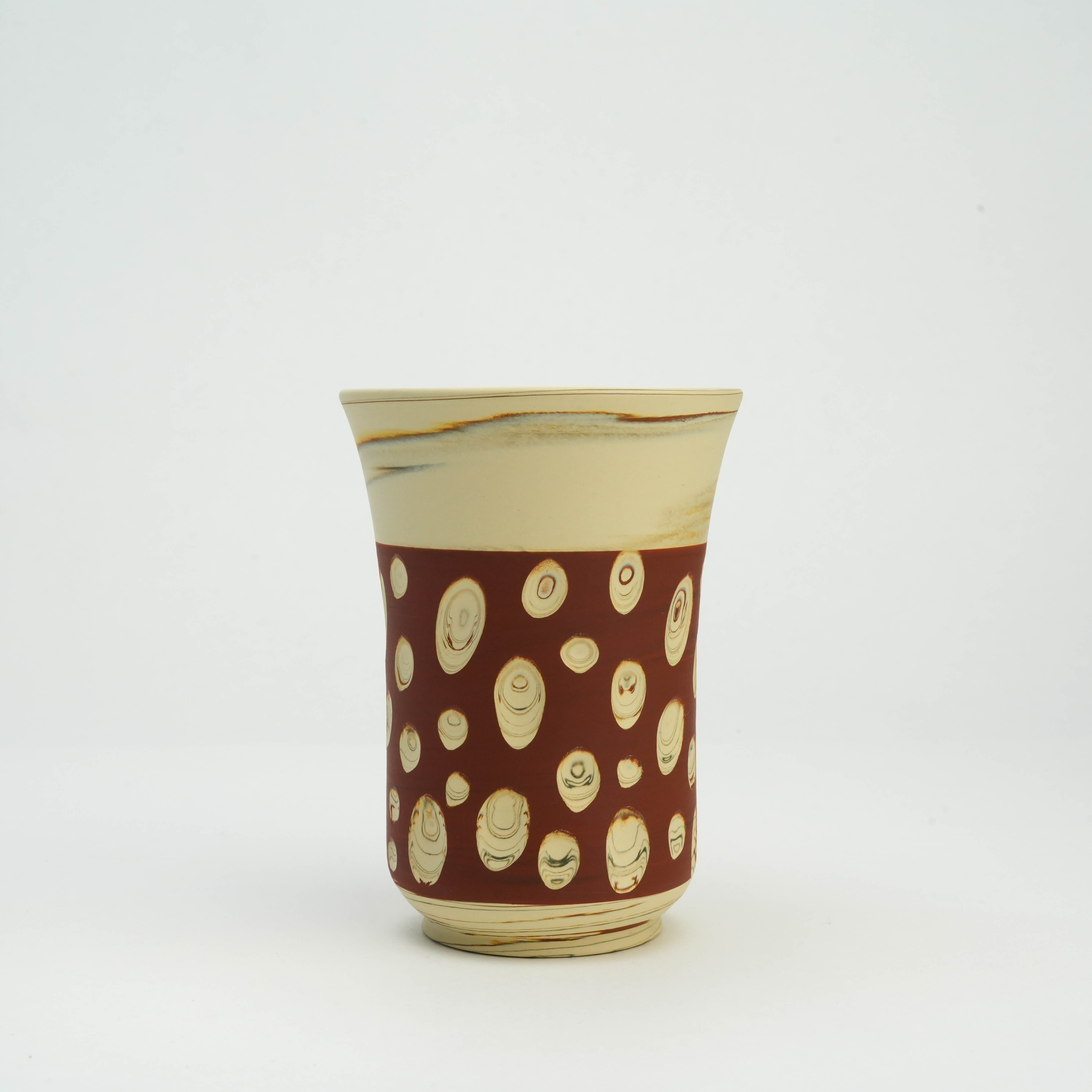 Handmade Tokoname Ware Red Tumbler featuring a flared rim and whimsical cream polka dots, ideal for stylish tableware settings.