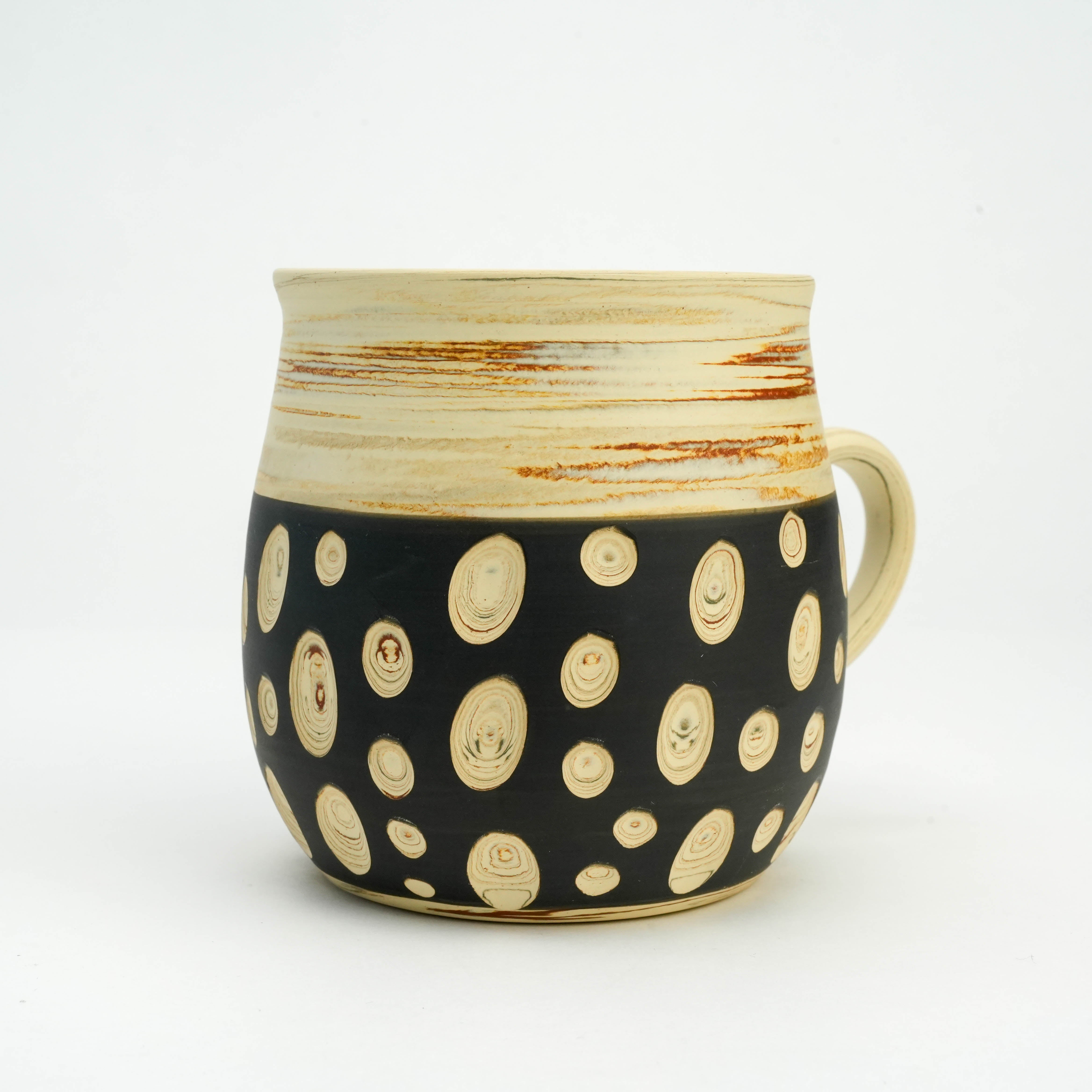 Close-up of Tokoname Mug - Handcrafted Ware | Polka Dots, Kenji Touen highlighting textured black ceramic with carved cream dot detailing.