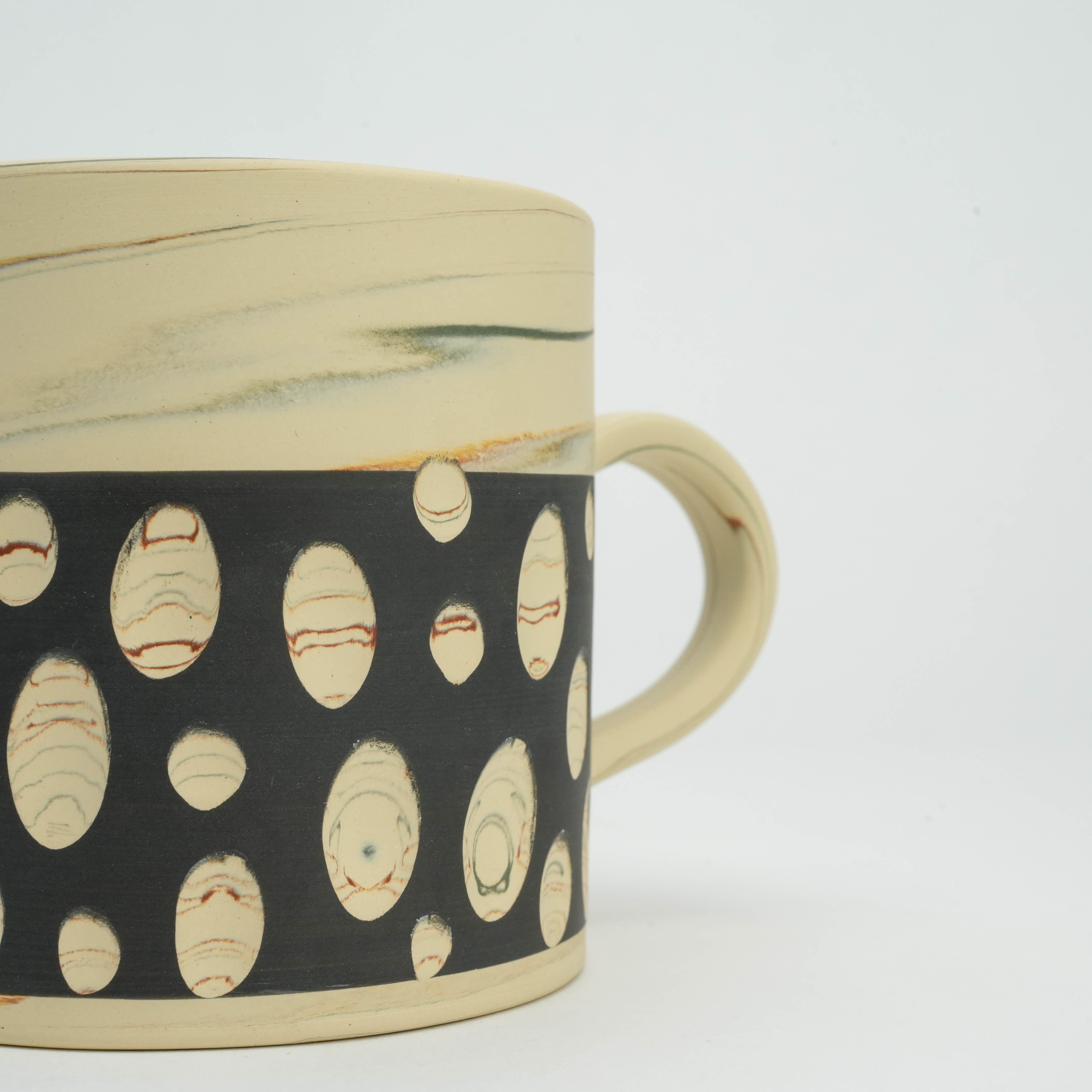 Close-up of Tokoname Ware Polka Dot Mug - Black showing intricate marbled dot detailing and artisan craftsmanship in Japanese ceramic design.
