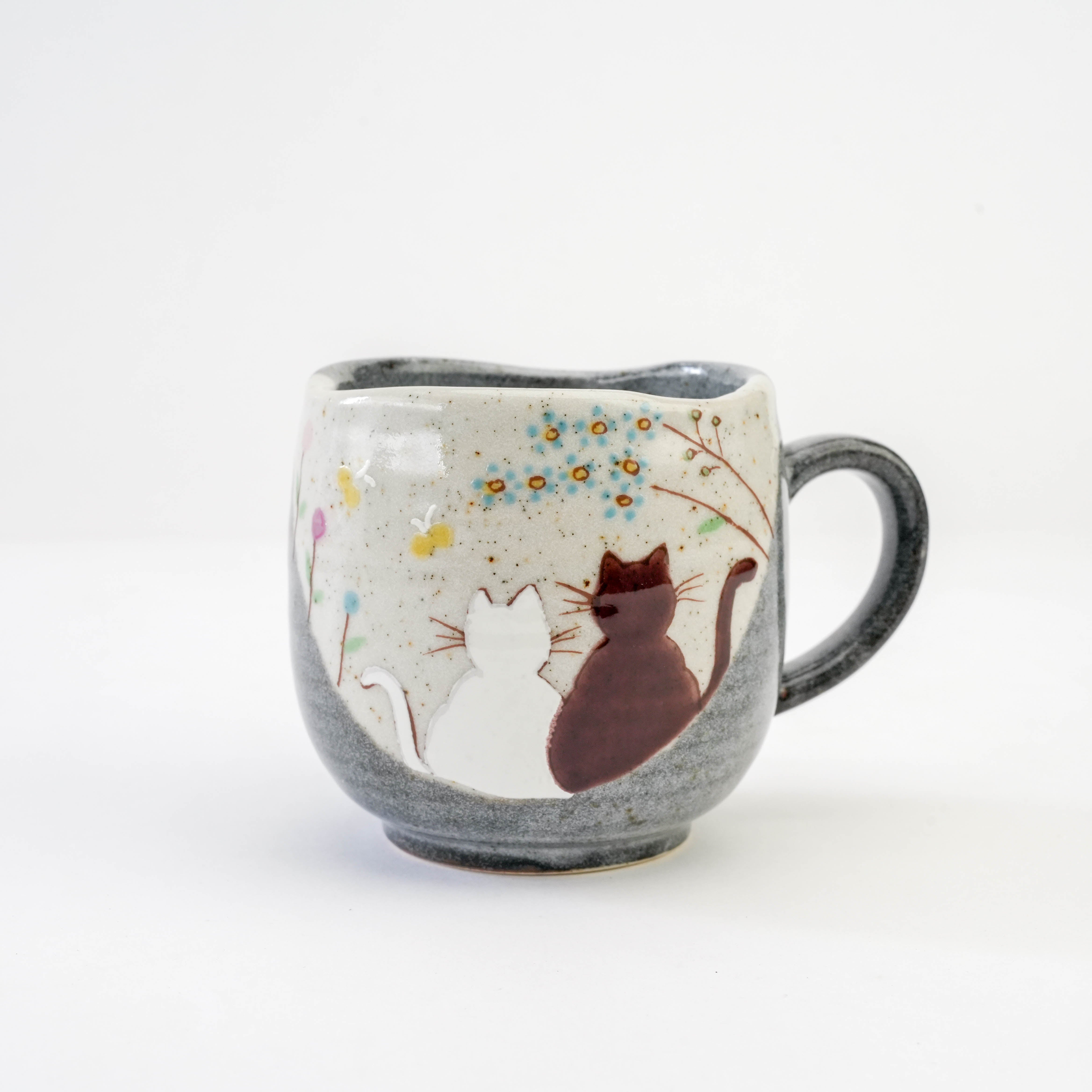 Close-up of the Kutani Cat Yunomi Teacup design with two cats under blooming branches, ideal for tea lovers and collectors.