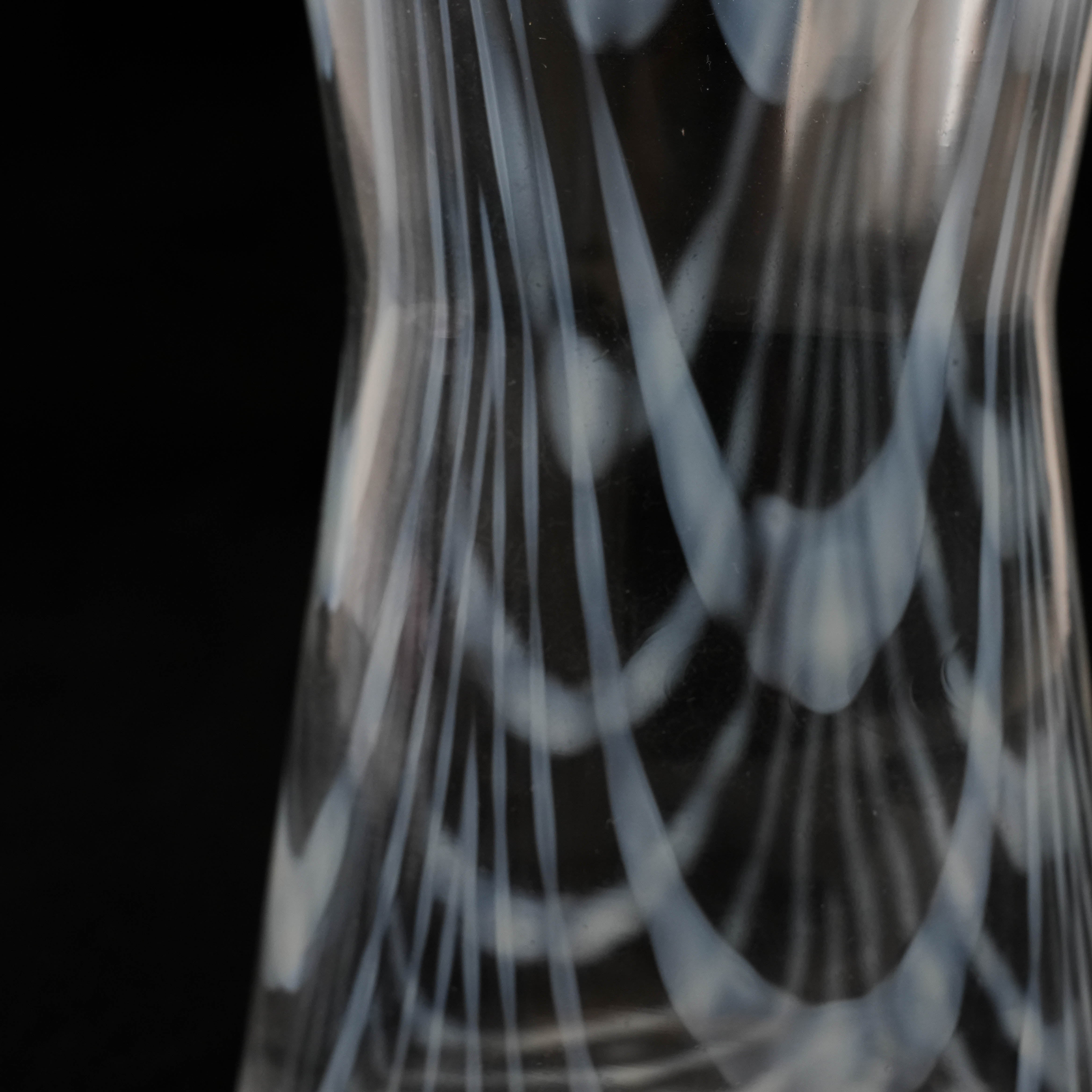 Detailed view of the Hirota Glass Taisho Roman Carafe’s midsection, emphasizing the elegant winding pattern in the glass.