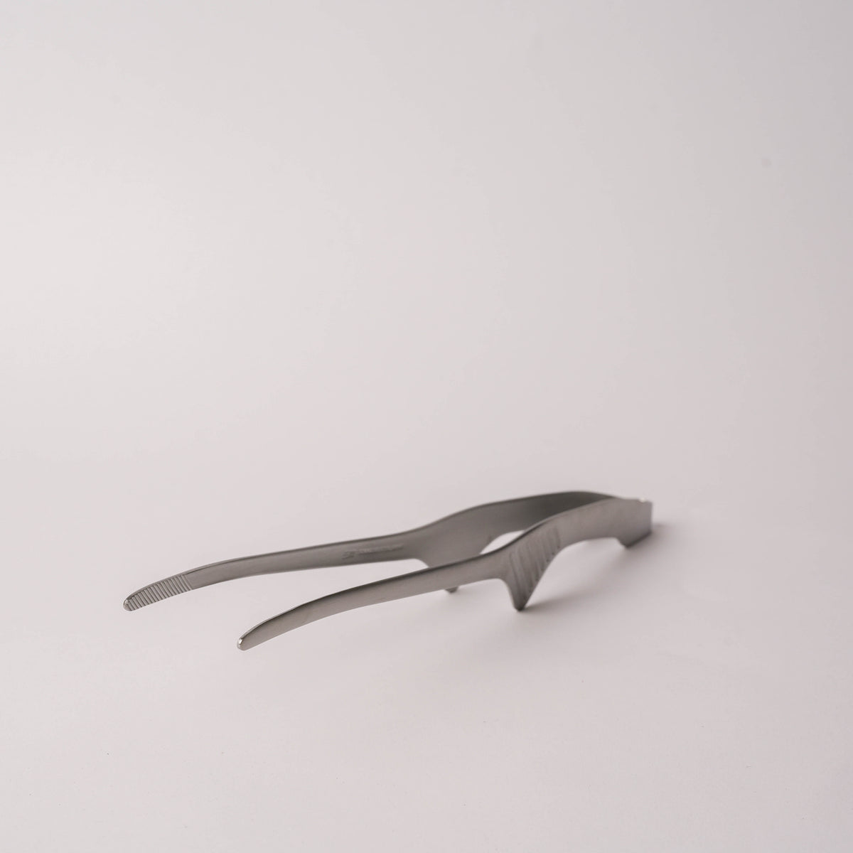 Stainless steel tongs with textured grip and slim shape, suitable for cooking and serving, SKU: 2052551